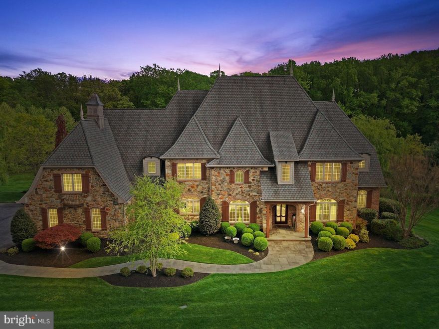 BUYERS FINANCING FELL THROUGH. Welcome to 7 Ridge Farm Court, a luxurious French Country home that embodies the pinnacle of high-quality finishes, comfortable living, sophistication, convenience and privacy. Nestled in the desirable neighborhood of Fallsbourne in Cockeysville, this stunning property presents an unparalleled combination of elegance, modern amenities, and outdoor entertainment with its captivating inground heated pool and covered patio above. 
As you approach this exquisite property, you'll be greeted by its stately presence and meticulously manicured landscaping and butler stone walls and bluestone walkways. The elegant architecture boasts a harmonious blend of classic design and modern luxury. Double and tiple crown moldings can be found throughout this stunning home along with reclaimed wood floors and many gas and wood burning fireplaces. The open-concept layout seamlessly connects the grand foyer to the inviting living spaces, creating an atmosphere of seamless flow and abundant natural light. The gourmet kitchen is a chef's dream, featuring top-of-the-line stainless steel appliances, granite countertops, and ample cabinetry. Whether you're hosting a grand soirée or enjoying a quiet meal with family, this kitchen is both functional and aesthetically pleasing.  First floor Primary Bedroom offers stunning views of the backyard and access to the bluestone patio.  Primary Bath recently updated with radiant floors, two vanities, a large soaking tub and walk in shower. Two custom walk in closets just off the bathroom. Upper level includes an extra recreation room with bar, a second laundry room and four bedrooms and three baths.  This private paradise surrounded by lush landscaping and spacious patios provides an idyllic setting for entertaining, relaxation and recreation.  The attached three-car garage offers ample space for vehicles, additional storage, and a dog bath, all adding to the practicality of this exceptional property. The lower level is fully finished with an additional bedroom, ensuite bath, powder room, full kitchen, movie theatre, spacious workout room and recreational room. This property seamlessly combines elegant living spaces, modern comforts, and an outdoor haven, making it the ideal retreat for those who appreciate the finer things in life. Enjoy the serenity of suburban living while remaining conveniently close to urban amenities, renowned schools, shopping, dining, and major transportation routes. Come experience the luxury and tranquility that await within this unparalleled residence. Schedule your private showing today!