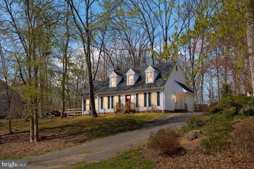 Charming Cape Cod with endless potential in the gorgeous, established, no HOA Hamlin Hills neighborhood of Stafford County. Situated atop a hill offering beautiful views, this picturesque Cape Cod home boasts undeniable curb appeal, framed by a serene wooded yard with natural beauty. With 4 bedrooms and 3.5 baths, including two primary bedroom suites (one on the main level and one on the upper level), this home provides flexibility and comfort for a variety of living arrangements.

Recent major updates, including a newer roof and HVAC units, mean you could move right into this home. Or if desired, the interior presents an exciting opportunity for a transformation.

For those with vision, this home is a blank canvas ready for renovation, allowing you to modernize the space and infuse it with your personal style. The layout provides great potential! With "good bones" and over 2,100 sq.ft., with the right updates this home could see significant added equity. If you're looking to create your dream home, this is the perfect place to make it happen! Please note this home is being sold as-is.