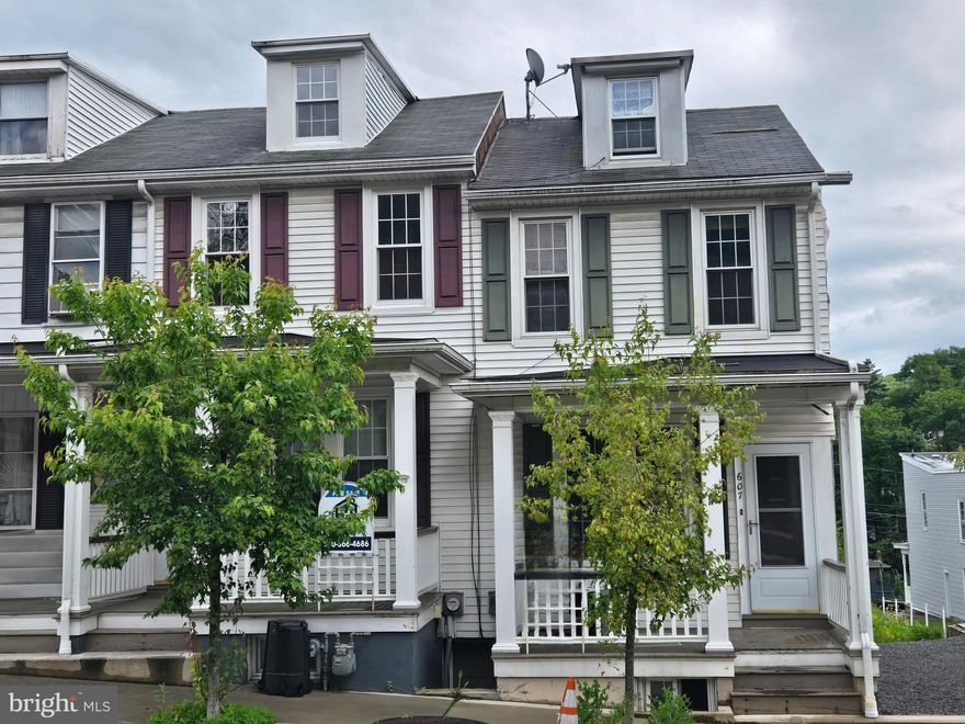 This 2 bedroom 1 bath house is just steps from the hospital and is ready for someone new to make it a home. This home does need cosmetic work through out (floorings, some drywall work, paint) and some sweat equity could go a long way. Finished hardwood floors adorn the main living areas and the hardwood floors in the bedrooms, once covered by carpet, could be refinished. The kitchen has a tile floor and just needs a good cleaning. The home is heated by forced hot air provided by an oil furnace. There is a finished attic that needs some cosmetic work as well.  There was fire in the home that used to be attached to this home. Residing will need to be completed by the buyer on that side. Home is being sold as is. Cash or Renovation Loans only. Empty lots next door are available for sale as well.