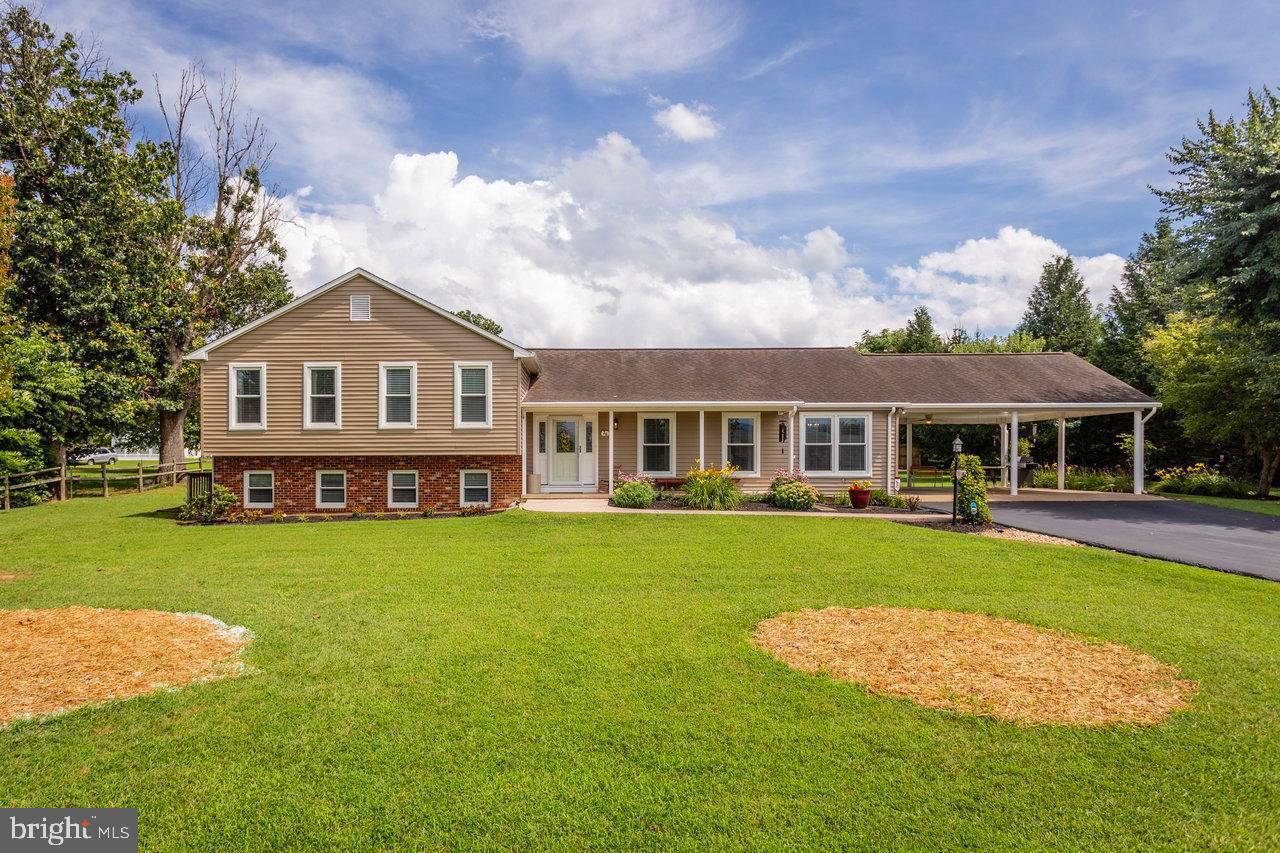 With SO MANY wonderful features of this home… WHERE… DO… YOU… START ?? This one owner, custom built, brick & siding home is gorgeous! Nestled on over a half acre of level lawn with numerous floral gardens inside a fenced and private back yard, this home boasts “5” distinct outdoor living areas that include; front country porch, extended oversized carport with covered swing & cooking area that spills onto the patio. Past the patio is a connecting walkway to the breezy screened porch. Then, the upper balcony deck off of the Owner’s Suite has extra supports… ready to support your hot tub. Check out the 20' x 12' workshop and the 16' x 16' patio out back. WOW!! Come on… let’s go inside. Here, you’re greeted by a spacious and inviting foyer with gleaming solid red oak, wide plank flooring that continues through the Family Room, Kitchen & Dining Room - stunning! Do you like to cook and entertain? Check out this enormous updated kitchen with loads of modern upgrades and details including granite counters, appliances, stainless sink, pendant lighting, and a breakfast bar/island. The second island flows into the open concept family room, which opens to the fully screened-in porch with custom sun shade draperies. The expansive Owner’s Suite has plenty of TV/sitting/reading area and opens to the private upper balcony deck. As you head toward the en suite bath there’s a dressing area with two generous walk-in closets. Finally, the suite is finished off with a convenient en suite laundry.
What’s downstairs? There you’ll find an inviting great room full of daylight windows & and an exterior door. Plus, a cozy gas heater surrounded by a full wall & hearth of brick to radiate heat in cooler months.
What’s behind the curtains? Go ahead, you can look. For now it's used as a storage and moving prep area. It's a big bonus room with windows that can easily be converted to a 4th bedroom that already connects to the huge half bath. This bath is roughed-in for a tub/shower and has its own walk-in clothes/storage closet. The lower level could easily become a separate & private living area with its own private exterior access, just off of a separate designated parking area. Perfect for older family members, or even boarders for some extra income.
Don’t miss out on making this fantastic place YOUR HOME !! Schedule your tour... TODAY !!