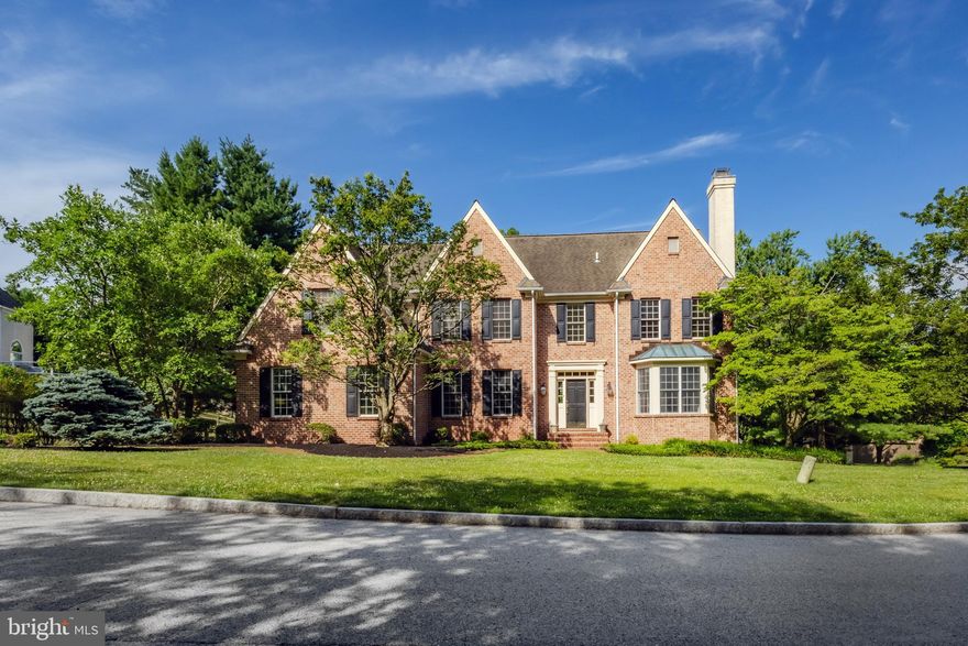 Welcome to 104 Leighton Dr, Bryn Mawr, Radnor Township.  This gorgeous center hall Colonial is located in the beautiful neighborhood of Sturbridge, offers a complete move in ready appeal, has classic details throughout and has been loved by its current owners since it was built.  This spacious home has 5 bedrooms 4 full 2 half bath home has close to 5,000 square feet above grade, tons of versatile space and is located in the exceptional Radnor school district.  Pull up and instantly fall in love with the classic brick curb appeal, construction details and mature landscaping.  When you walk into this home you’ll notice the abundance of natural light coming from every direction, front to back, side to side. You feel happy when you walk in the front door and the 2 story foyer greets you.  The first floor has an amazing circular flow, large room sizes and great functionality.  The formal living room has a gas fireplace with custom mantle, a custom built in window seat, recessed lighting, crown molding and gorgeous oak hardwood floors.  The formal dining room has a tray ceiling, wainscotting and is the perfect place to host holiday dinners.  The kitchen/great room is the perfect space for everyday living!  The kitchen has custom cherry cabinetry, a vaulted ceiling, Corian countertops, glass front cabinets, center island with seating, top of the line appliances including a sub zero and plenty of room for a large breakfast table.  Enjoy easy access to the large back deck right off the kitchen, perfect for BBQ’s, hosting large crowds or enjoying the tranquility the backyard has to offer you. The great room has custom built-ins, another gas fireplace and offers a view of the beautiful park-like backyard.  The office space on the first floor has an adjoined full bath, in the event you need one level living!  This space could make a great guest room or playroom.  Also on the first floor is a wonderful mud room with main level laundry, with access to the interior access garage, a walk-in pantry and guest’s powder room.  The circular flow of the first floor is amazing and so are the large windows and natural light at every turn!  Upstairs you’ll find a very large and well appointed primary suite with everything you’ll ever need!  A sitting room/office, huge closet room, large full bath with soaking tub and shower and room for larger furniture.  4 additional bedrooms and 2 more full baths for convenience.  The upstairs hall has a custom office nook built in- great for homework or overflow work space!  The entire first and 2nd floors have oak hardwoods in pristine condition- very rare to have hardwoods on the 2nd floor of a home like this!  It’s so clean and cohesive.  The walkout lower level (at grade level so the natural light is awesome) is another great space for whatever your needs may be.  There is a large rec room space with a French door leading out back, a half bath, a room that can be an office or storage room and a huge unfinished area where the utilities are.  This home is so classic and so beautiful.  The love it’s had over the years is evident and it’s a wonderful place for you to call home.  Take advantage of the close proximity to some of the best schools around, parks, some of the best restaurants and shopping and much, much more.