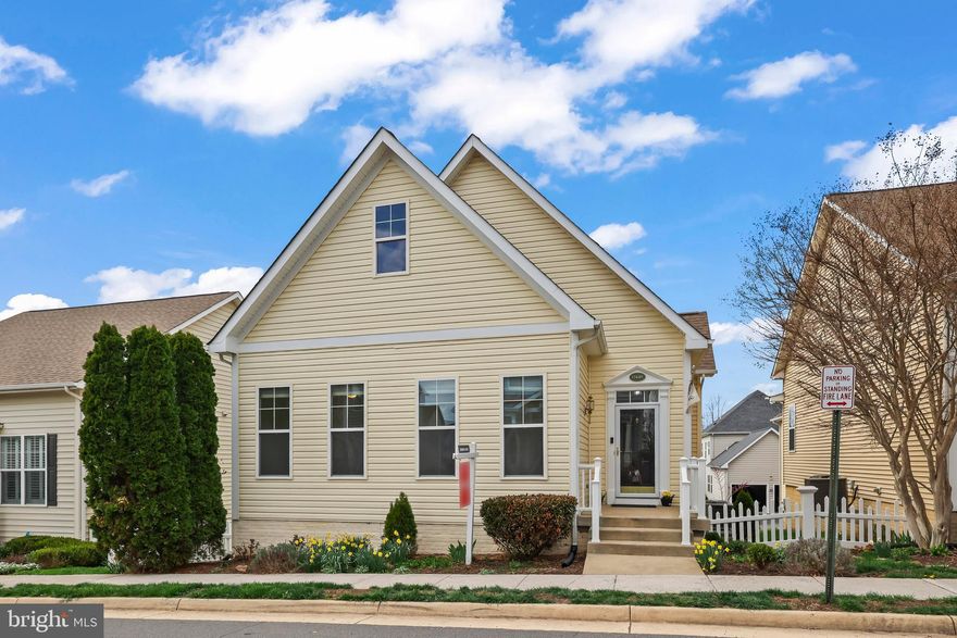 Enjoy effortless one-level living in this beautiful, move-in ready home! The main level features three spacious bedrooms, two full baths, a half bath, and a convenient laundry area—all thoughtfully designed for everyday ease.

The fully finished walk-out basement provides incredible additional living space, including a fourth bedroom or rec room, a full bath, a large storage area, and an oversized two-car garage, plus a stone patio under the deck offering shade and privacy for relaxation.

Step inside to an inviting open floor plan with gleaming luxury vinyl plank flooring throughout. The eat-in kitchen is a true centerpiece, featuring a large island, modern finishes, and seamless flow into the formal dining room and cozy living room with a fireplace—perfect for both entertaining and relaxing evenings at home.

From the kitchen, step out onto the deck and enjoy views of the charming white picket-fenced yard—ideal for gardening, pets, or simply unwinding outdoors.

Privately situated at the rear of the home, the spacious primary suite is a true retreat. Enter through double doors into a serene space complete with a sitting room or home office, a large walk-in closet, and a luxurious en-suite bath featuring a soaking tub, walk-in shower, double vanity, and private water closet. Two additional bedrooms are located at the front of the home and share a well-appointed full bath.

Recent updates provide peace of mind, including a new water heater, water softener, reverse osmosis kitchen system, newer HVAC, new refrigerator, new ceiling fans throughout, fresh interior paint, new roof boots, and a freshly resealed driveway.

Located in an exceptional Round Hill community, residents enjoy a scenic, tree-lined green space with a paved walking trail that winds around the neighborhood and alongside Sleeter Lake. The trail connects to Franklin Regional Park, offering a swimming pool, sports fields, pickleball courts, and a performing arts center. A pedestrian tunnel provides easy access to historic Round Hill and its charming year-round events.

Best of all, the HOA includes full lawn maintenance—no mowing, mulching, or trimming—allowing you to truly enjoy low-maintenance living (excluding fenced yard areas).