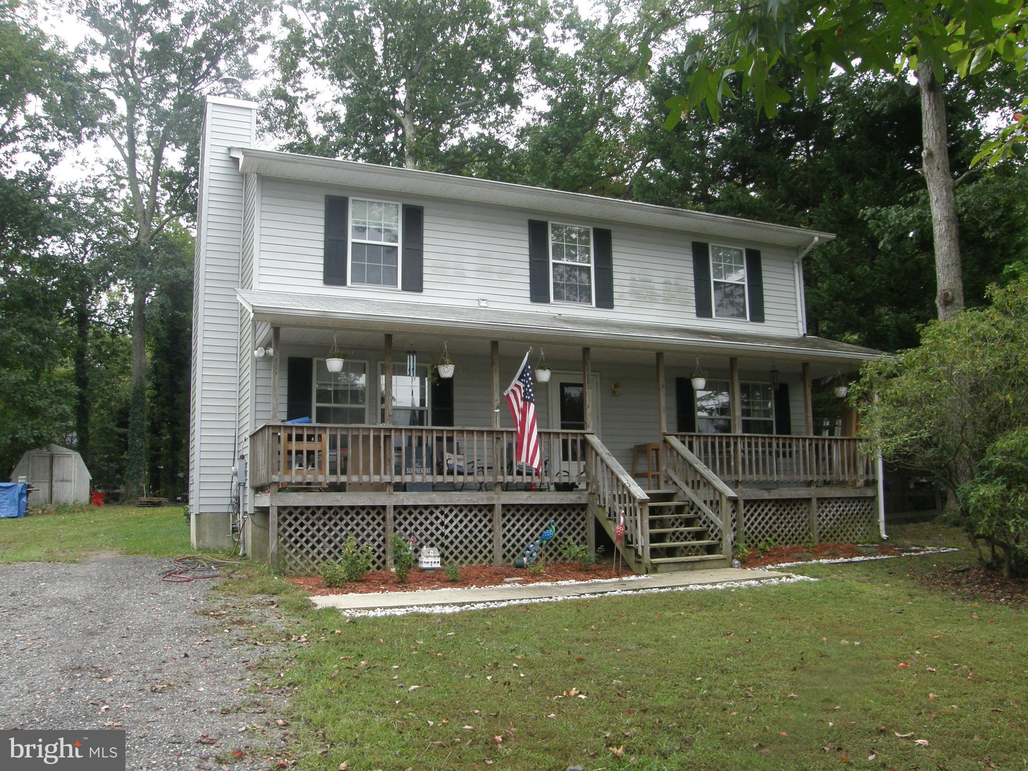 Very nice colonial with 3 Bedrooms, 2.5 Bathrooms, LR/FR/ Office located on useable partially fenced lot with three sheds. Very nice front porch and spacious deck for relaxing or social visits. Close location to lake lariat with boat ramp for non gas powered boats, large sandy beach for swimming, and two beaches on the Chesapeake Bay. Don't miss the community garden space, basketball courts, or campground. Club house available for events! Easy access to work and shopping plus schools will insure convenience for the family. This home is priced very well for the market don't pass this up it could be you!!!!