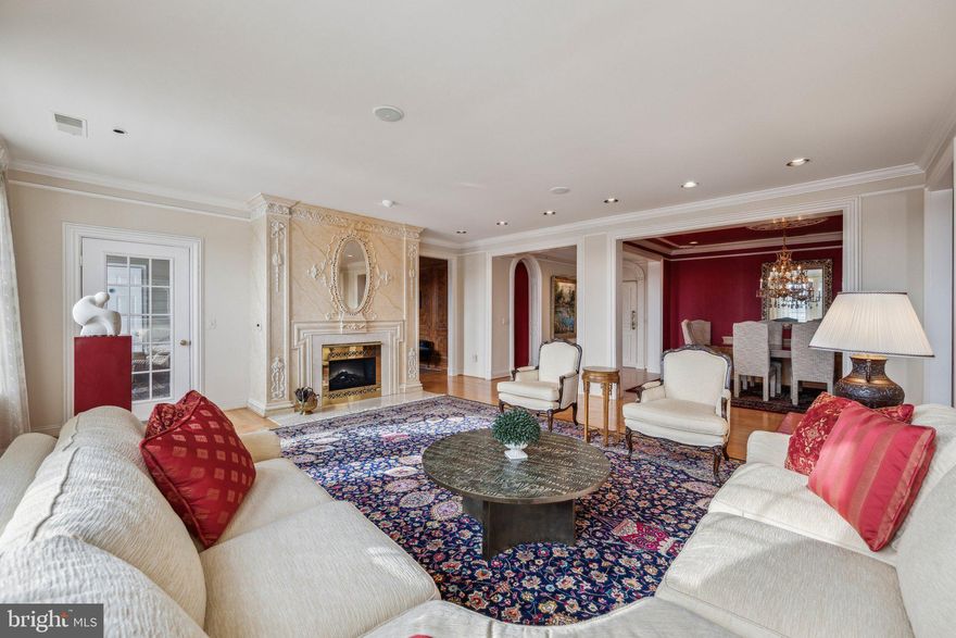 New price! Step into a lifestyle of sophistication and elegance with this rarely available penthouse corner unit! Offering breathtaking views of lush parkland from two private balconies, this extraordinary home is nestled in one of the most prestigious luxury (elevator accessible) condo buildings, complete with impeccable amenities - everything you need to enjoy the best of both indoor and outdoor living. Boasting the largest floor plan available, this residence is a one-of-a-kind gem, featuring new Thompson Creek windows that flood the home with natural light. The intricate custom woodwork, custom blinds and drapery, unique built-ins, and wine storage add timeless charm and functionality, while the hardwood floors throughout create a warm, cohesive ambiance. Perfect for entertaining, this home offers a formal living room and dining room as well as an eat in kitchen and den.  The open, inviting layout flows effortlessly from one space to the next. The gourmet kitchen is a true showstopper, featuring ample granite counter space, a huge center island, double oven, under cabinet lighting and stylish cabinetry. Two HVAC systems and two tankless water heaters add an extra layer of comfort to your daily routine. You'll appreciate the convenience of two separately deeded private garage parking spaces and two deeded storage units. Enjoy exclusive access to the community’s clubhouse, pool, and fitness center, or take a stroll across the street to Fallsgrove Park, a stunning 30-acre retreat with nature trails, tennis courts, playgrounds, and a community garden. With the Fallsgrove Village Center just steps away, you'll have shopping, dining, and entertainment right at your fingertips. This pet-friendly building welcomes up to two pets, making it a perfect fit for those seeking a luxurious home with all the conveniences of modern living. Located just off I-270, this sought-after location offers a rare opportunity to own a truly exceptional property.