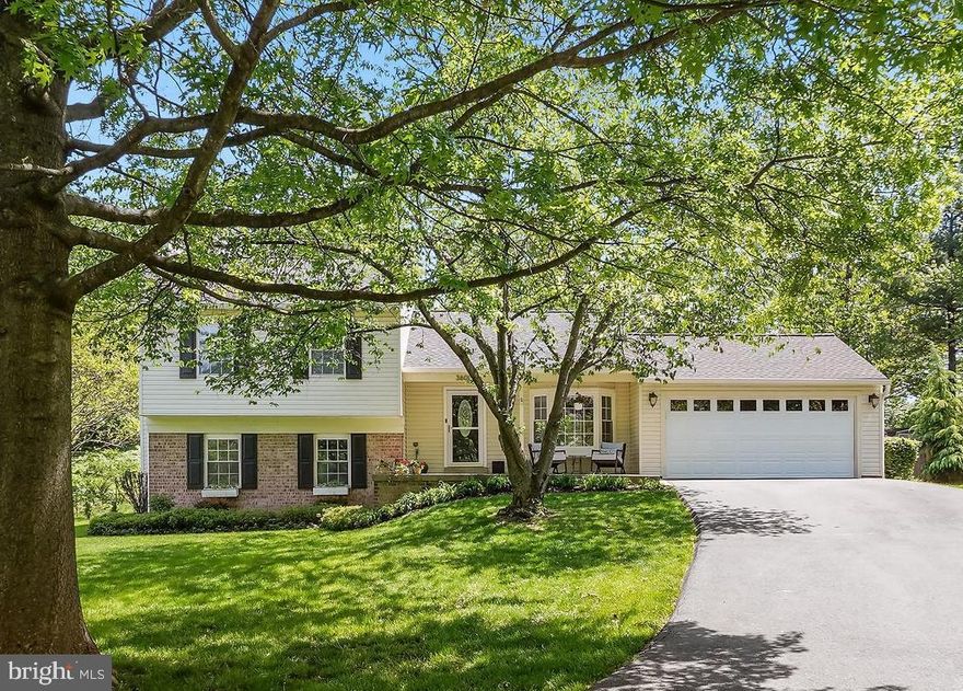 Welcome Home to this Fantastic Updated and Light-Filled Split-Level Home Located on a Quiet Cul de Sac in Popular Williamsburg Village. Almost Every Space in this Home has been Improved and Enhanced and the House is Move-In Ready with Fresh Paint and New Carpet. The Main Living Level Boasts an Amazing High-End Kitchen Renovation and a Beautifully Crafted Open Living Concept with Vaulted Ceilings, Recessed Lighting and Luxury Vinyl Flooring.  The Gourmet Kitchen includes Quartz Countertops, Stainless Steel Appliances, Cabinetry with Smart and Abundant Storage Solutions and a Large Island with Plenty of Seating.  Relax in the Spacious Living Area or Step Out onto the Trex Deck for a Peaceful Cup of Coffee in the Private, Fenced Back Yard. Head Upstairs to Find a Large Addition Primary Suite with Vaulted Ceilings, Recessed Lighting, a Generous Seating Area, Large Walk-In Closet, and a Devoted Primary Bath with a Dual Vanity and Separate Shower.  Down the Hall, find an Oversized Bedroom (that can easily be converted back to the original two bedroom configuration) and a Renovated Hall Full Bath with Italian Tile and Pretty Finishes. The Laundry Room is also Conveniently Located on this Level.  The Downstairs Level Features a Large, Bright Family Room with a Wood Burning Fireplace and Built-In Shelving. There are Two additional Bedrooms, a Gorgeous Remodeled Full Bath and a Spacious Storage Room to Finish the Space. Top All of this Off with a Large Two-Car Garage with a Brand New Door!  Additional Bonuses include a 3 Year Young Roof and Dual Zone Heating and Cooling. The Home also Assigns to Well Rated Schools, is in Easy Walking Distance to the Shopping and Dining Amenities in the Heart of Olney and is Close to the Inter County Connector too. This Home is an Absolute MUST SEE!!