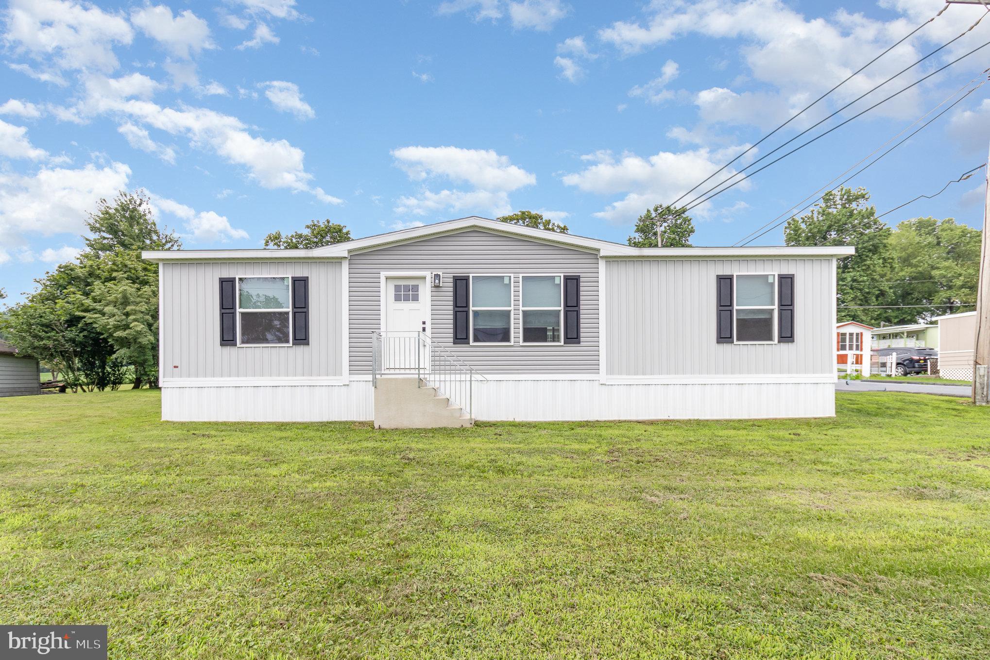 Welcome to this newly built 2024 manufactured home in Lebanon Valley Mobile Home Park! This 3-bedroom, 2-bath residence offers comfortable, modern living on a beautiful green lot. Inside, you'll find a spacious kitchen featuring stainless steel appliances, abundant cabinetry, and a large island perfect for cooking and gathering. The open layout flows seamlessly into the living area, while a full laundry room adds everyday convenience. Whether you're relaxing indoors or enjoying the peaceful outdoor space, this home delivers comfort, style, and affordability in a well-maintained community.