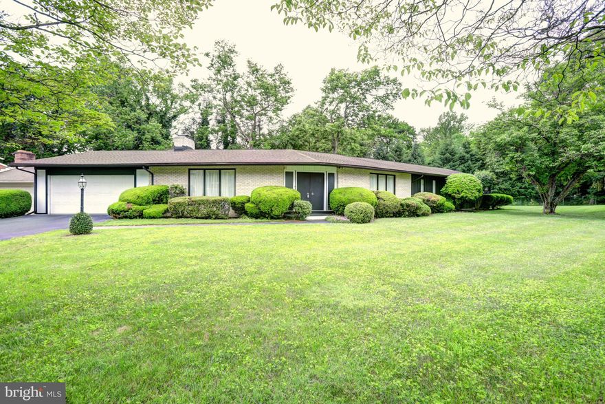 Fabulous mid-century modern rancher on a beautiful corner lot in the wonderful Fountainhead community. One owner, and impeccably maintained; new heat pump May 2021. Located near Fountainhead Country Club, this property features 4 Bedrooms, 3.5 Baths, and a true cathedral ceiling living room with fireplace. The spacious owner's suite walks out to the private deck and patio! Fully finished lower level, four season atrium room overlooking the rear yard . This is a very special property in a fabulous location. - come see today!