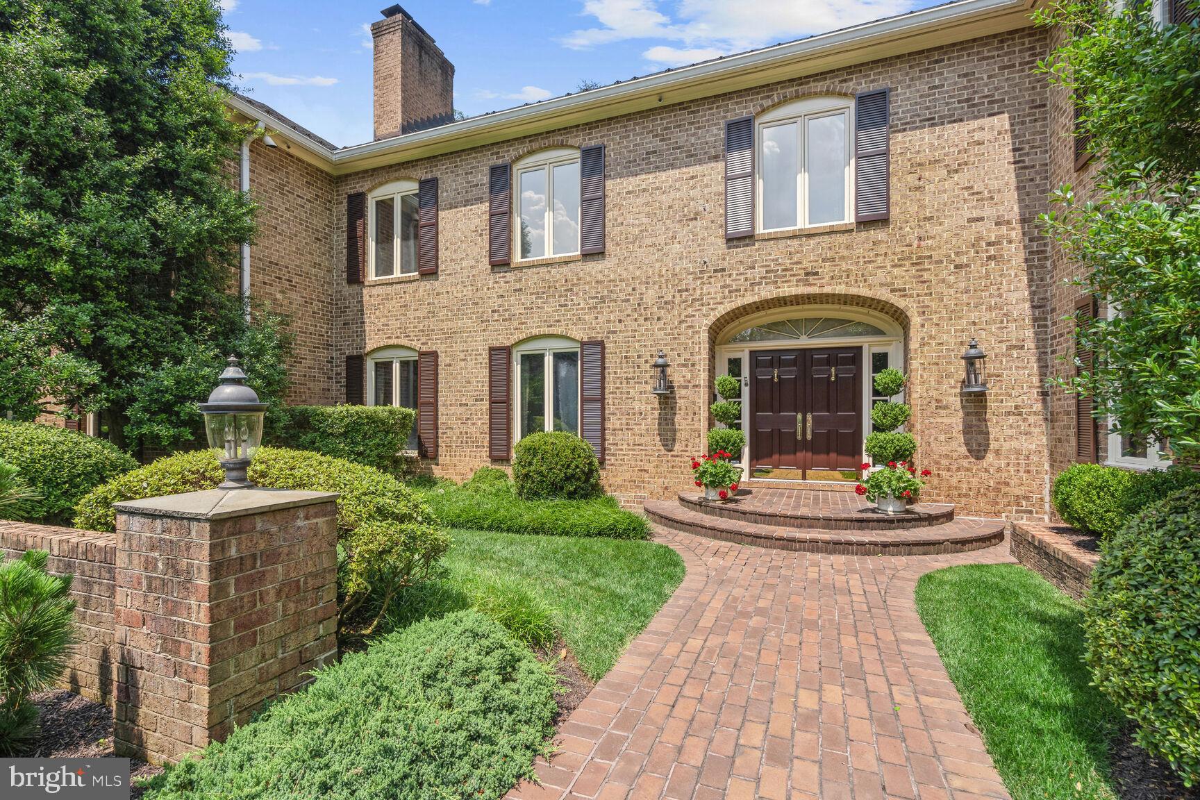 Situated on a gorgeous premium 2.28 acre lot in sought-after Potomac Falls, this magnificent custom-built brick colonial estate home, with 9'+ ceilings and over 10,000 sq ft of living space throughout three finished levels, includes a pool and pool house, tennis court, a circular drive, and 4-car garage parking, all impeccably maintained and loved by the current owners! Enter into the gracious 2-story foyer with marble flooring; to the right is the 17'x 21' library with custom built-in shelves and cabinets, a formal powder room, wet bar, and an elegant 21'x 26' formal living room with fireplace. To the left of the foyer is a 17'x19' formal dining room with a gas fireplace, a 20'x 20.5' family room with a wood-burning fireplace, the serious cook's kitchen with an enormous island, premium cabinetry, top-of-the-line appliances, granite tops, and the adjacent breakfast room with tons of storage/pantry closets. The main level has a renovated laundry/mud room with garage access, a 2nd powder room, two staircases to the upper level, and a fabulous 13.5'x 32' sunroom with skylights and walls of windows for views of the lushly landscaped backyard and the pool house! The upper level encompasses an extraordinary 19'x 24' primary bedroom suite with a gas fireplace and two beautifully renovated and appointed primary baths, one on each side of the dressing room, and closets galore. The 6th bedroom (which could be another family room or office) that is close to the primary bedroom suite, has a gas fireplace, an ensuite full bath, and a walk-in closet. Four other spacious bedrooms, with generously sized closets, and two additional full baths complete the upper level. The recently renovated lower level has a family room with built-in storage/shelving, a recreation/party/game room with a wet bar, a 7th bedroom with ensuite bath, a hobby/media room, an exercise room, another full bath, and two oversized storage/utility rooms. There are so many outstanding amenities throughout this stunning home! In addition to the exquisite flooring, moldings, and fine finishes, the home has a well-maintained slate roof, 5 HVAC systems (forced air heat and central air), a Kohler whole-house generator, and a (2019) 75-gallon water heater. The private backyard has a serene slate terrace, a tennis court, and a walkway to the oversized in-ground pool with diving board, gas pool heater, and automatic Polaris pool sweep, and the pool house with open entertaining space, a fully equipped kitchen, storage closet, changing room/full bath with shower, and a storage/utility room for pool equipment, etc....