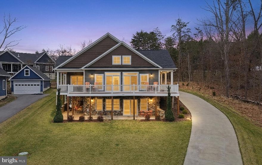 Wake up to shimmering water views, sip your morning coffee on a wraparound deck, and end your day kayaking from your own backyard—this is lake living at its finest! Custom-built by Joseph Mohr Construction, this like-new 6 yr young Craftsman-style home is perfectly positioned to capture expansive lake views from nearly every angle. Offering 4 bedrooms, 3.5 baths, and a 3-car garage, the home was designed for both everyday comfort and effortless entertaining. The open-concept main level stuns with luxury vinyl plank flooring, a striking beamed vaulted ceiling, and a floor-to-ceiling stone gas fireplace that anchors the space. Walls of windows flood the home with natural light while framing breathtaking water views. The gourmet kitchen is a chef’s delight boasting granite counters, custom cabinetry, walk-in pantry, and stainless steel appliances including a gas range. The primary suite is a true retreat, featuring a tray ceiling and spa-inspired bath with dual vanities, soaking tub, oversized walk-in shower, and private water closet. Downstairs, the finished lower level with kitchenette creates the perfect space for guests, game days, or multi-generational living. Step outside and the magic continues—an expansive wraparound Trex deck with covered dining area offers front-row seats to the lake, while your private kayak launch and stand make it easy to get on the water anytime. Built with quality and longevity in mind, this home features Hardie board siding, vinyl-wrapped exterior trim, a beautiful craftsman door, and gleaming transom windows. Located in a highly sought-after lake community offering beaches, boating, fishing, clubhouse, fitness center, trails, and more—all just minutes from Winchester and an easy drive to DC. Floor plan included in photos.
For separate sale: 2021 Hurricane Sundeck sport. 18.5', with a Load Rite trailer