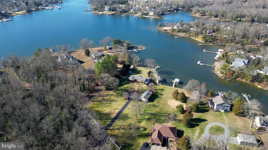 Experience the epitome of waterfront living at this exceptional property nestled along Spring Cove in the coveted Cuckold Creek of the Patuxent River. Meticulously maintained, this home boasts an extensive bulkhead that frames the shoreline, a wraparound pier, a private covered boat lift, and deep, protected waters, offering unrivaled access for aquatic adventures.

Entertain your friends and family on the expansive wraparound decking with an outdoor kitchen, fire pit, and screened patio, all set against breathtaking water views.

Inside the main home, discover a spacious open layout adorned with updated features, including a modern kitchen, three bedrooms, and three full bathrooms. The fully finished walkout basement provides additional living space and versatility.

Step outside to explore the mature, elegant landscaping surrounding the property, enhancing its natural beauty and tranquility.

The detached guest house offers privacy and comfort for guests or extended family, complete with a two-car garage for added convenience.

From sunrise to sunset, indulge in the luxury of waterfront living and create cherished memories in this idyllic retreat.

Schedule your private tour today and discover the allure of this waterfront gem!