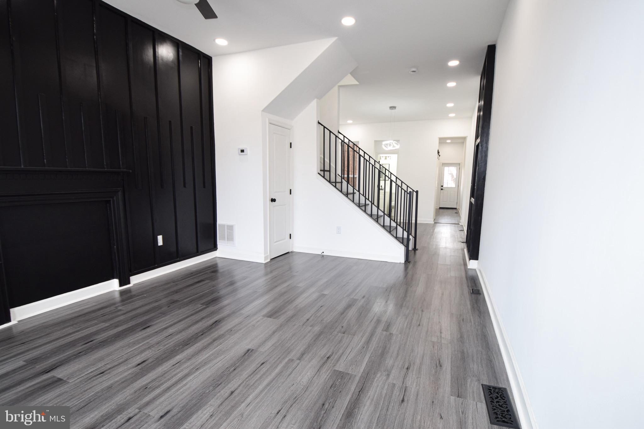 Be sure to see the VIRTUAL TOUR for a 3d tour of the home!.... Looking for a home that is gorgeous and the envy of your friends and family. Look no further. This home boasts luxury vinyl plank flooring, A full Living room, separate dining room, and a generous kitchen. Also included on the first floor is a half bath, newly built deck, fenced in back yard, and parking off street. Up the stairs, find 3 bedrooms flooded with natural light, 2 full bathrooms and new everything throughout. Recessed lighting, high end kitchen, convenience, luxury, and move in ready!