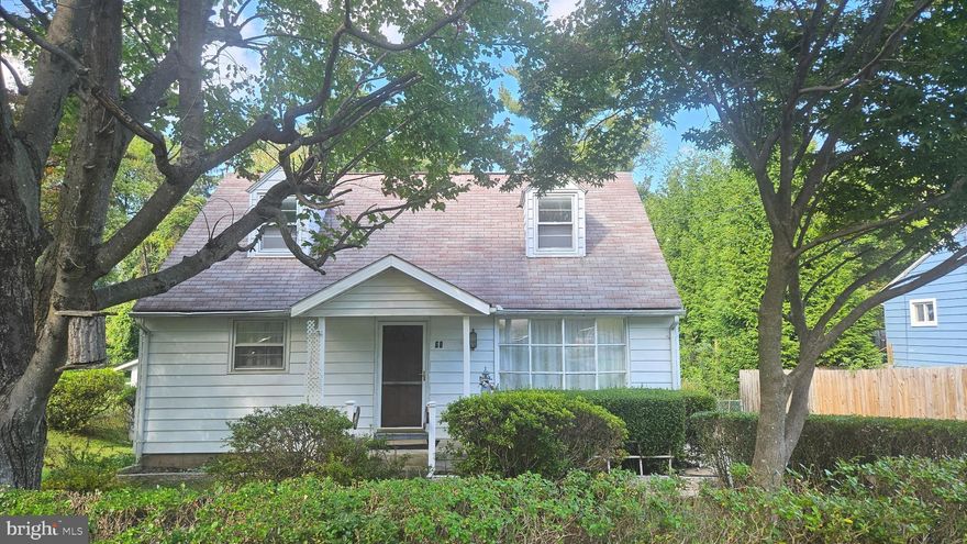 Nestled in the desirable Tollgate neighborhood, this thoughtfully maintained Cape Cod-style home blends timeless architectural character with opportunities to make it your own. Step inside to a bright and inviting living room filled with natural light from a large bay window. The first level also features a welcoming dining room with warm wood accents, a cozy kitchen with classic oak cabinetry, two comfortable bedrooms, and a full bath. The fully finished lower level offers incredible versatility, including a spacious recreation area, a separate room with potential for a fifth bedroom, a laundry area, and a dedicated storage space. From here, step into the airy sunroom, a perfect spot to relax, overlooking the private, fenced backyard.

Outdoor living shines in this property’s expansive yard, complete with two storage sheds and a gazebo. Whether you envision hosting gatherings around a fire pit, playing yard games, adding a pool, or simply enjoying the outdoors, this space is ready for it all. Parking is convenient with both a private driveway and additional on-street options, ensuring plenty of space for you and your guests. Located just minutes from shopping, dining, and major highways, with metro stations less than 3 miles away, this home offers an easy commute and great access to amenities. The Tollgate community itself provides a welcoming neighborhood atmosphere with local parks and recreation nearby.

Don’t miss the chance to make this charming home your own, schedule a showing today before it’s gone!