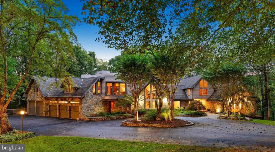 Welcome to the best of Aspen in Great Falls! Enter through the gates to a spectacular setting sited on 6 verdant acres and drive down the circular driveway to find a private resort with stack stone hardscape, lawn art and mature landscaping.  Light-filled Grand Foyer.  Hand-forged Cardine Studios custom iron railings, exposed wood beams and stone fireplaces throughout.  Gourmet Kitchen with Thermador/SubZero appliances, spacious island, big picture window with scenic, wooded vistas and a balcony that  overlooks a fabulous pool and pond.  An adjacent morning room with stone terrace doubles as entertaining or study space. Expansive A-Frame family room with beams, fireplace, and multi-level deck access. Main level includes second Owner’s suite with luxe bath, Au-Pair/In-Law, luxurious laundry with stone accents, grand great room with fireplace and soaring ceilings. Upper level Owner’s suite features balcony, custom beverage center, two extra large walk-in closets and spa-like primary bath with heated floors, soaking tub and steam shower. Spiral staircase leads to rooftop sundeck with 360-degree views. Three additional Bedrooms with updated baths. Lower level offers multi-person office with conference area, wine tasting room, ventilated Cigar room, full Bath, IT room and workshop. Club level entertainment space with paneled Bolivian Rosewood includes game areas, professional bar, billiards, and Caterer’s kitchen.  Gym with “environmental bed” with steam, sauna and sun lamp. Oversized heated 5-car garage with lift. Resort-like grounds feature infinity pool/spa, multi-level decks,  slate patios, pickleball/sport court with basketball hoops and wooded seclusion.