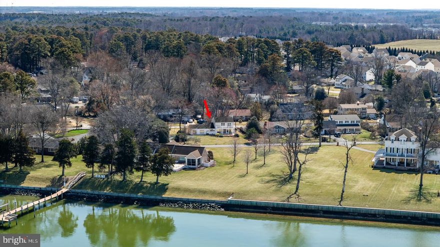 Stunning waterfront views of the Choptank await you at 7 Hatsawap Rd, Cambridge, MD 21613! Imagine unwinding on your multi-level deck soaking in breathtaking sunsets and peaceful water views. This beautifully updated home features three bedrooms and two-and-a-half baths. A welcoming foyer with marble flooring opens to wood floors that extend throughout most of the home. The updated kitchen offers quartz countertops, newer appliances, and a convenient breakfast bar, with separate breakfast area. A formal living room with a cozy fireplace, separate dining area, and  large family room provide versatile spaces for both everyday living and special gatherings. The second floor primary suite is a little retreat, offering a vaulted ceiling, walk-in closet, private bath, and balcony access with water views. Situated on a desirable corner lot just minutes from the community dock with water access, this property also offers paved parking for added convenience. Close to historic downtown Cambridge, shopping, restaurants and more! No town taxes! Not in a flood zone.