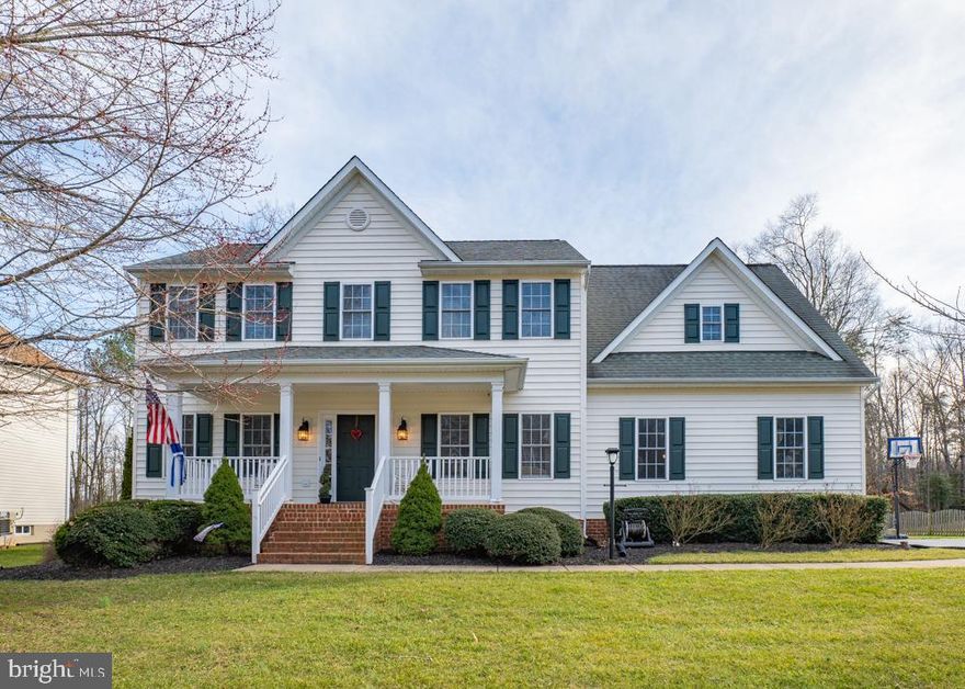 Looking for the perfect home?  This beautiful colonial is in an upscale community located just minutes from downtown Fredericksburg. Notable features include: front porch, side load garage, sunroom, stone FP, stainless appliances, new flooring, luxurious Master Suite, upstairs laundry, finished basement w/ full bath, rec room, 2 more rooms & an unfinished storage area. Flat backyard, patio, garden area & backs to trees!