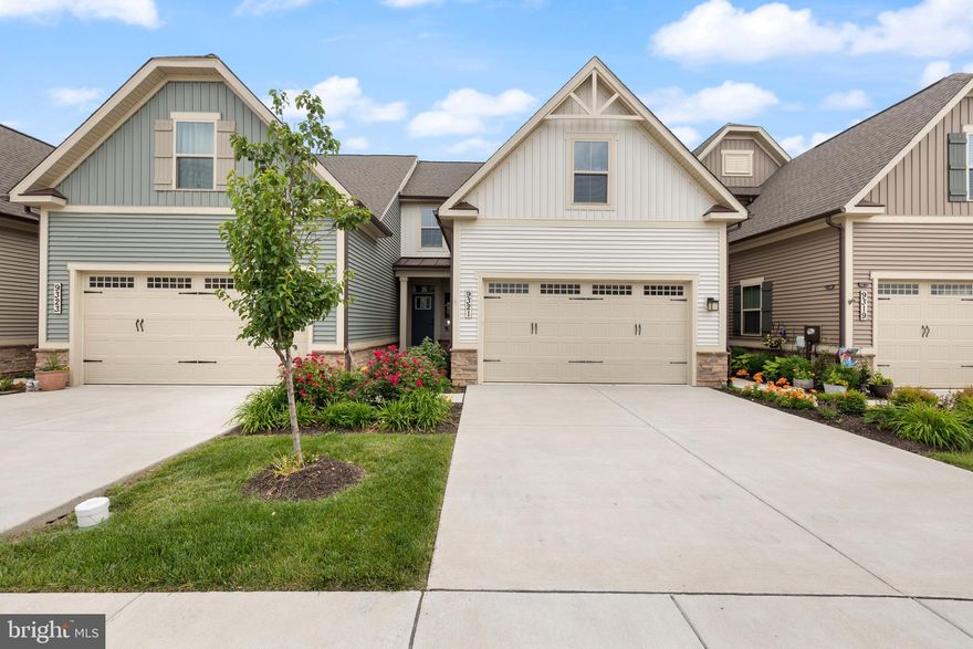 This home has an assumable VA loan at 2.99% 
Luxury Villa Living with Accessibility in The Woodlands of Urbana – A Premier 55+ Community
Welcome to your dream home in the prestigious Woodlands of Urbana, an exclusive 55+ community where luxury, comfort, and accessibility come together in perfect harmony. This better-than-new villa has been thoughtfully designed for ease of living, offering high-end finishes, modern conveniences, and accessibility features throughout.
Step inside to an inviting open-concept floor plan where the kitchen, dining area, and living room flow seamlessly together, creating the perfect environment for both everyday living and entertaining. The entire main level is step-free, allowing for easy mobility and wheelchair access, and features wide hallways and doorways to accommodate assistive devices comfortably.
The chef’s kitchen boasts upgraded, easy-to-reach cabinetry, soft-close drawers, under-cabinet lighting, and modern stainless steel appliances. Whether you’re a seasoned cook or just enjoy a stylish and functional space, this kitchen checks every box. The gorgeous plantation shutters throughout the home add classic charm while also offering easy light control and privacy with minimal effort.
Just off the living area, the rear porch provides a peaceful retreat with scenic views of open green space, ensuring privacy and tranquility.  It’s an ideal space to enjoy your morning coffee or evening relaxation.
The main-level primary suite is a standout feature, offering a tranquil and private space to unwind at the end of the day. It includes a spacious accessible ensuite bath complete with a walk-in shower, grab bars, comfort-height vanity and toilet, and non-slip flooring. A generously sized walk-in closet provides easy access to all your wardrobe essentials. Also on the main floor, you’ll find a half bath and a full laundry room with a side-by-side washer and dryer, all designed with convenience and accessibility in mind.
Venture upstairs to find two large bedrooms, a full bath, and a finished storage room. The additional bedrooms offer comfort and privacy for visiting guests or family.
The fully finished basement is another standout feature—spacious, light-filled, and flexible. With a rough-in for an additional full bath, it’s ready to become a media room, exercise studio, or additional living quarters. There's even space to install a stair lift if needed, offering future flexibility.
Beyond the home, The Woodlands of Urbana offers an unmatched lifestyle with resort-style amenities curated for active adults. The beautifully appointed community clubhouse serves as a vibrant hub with gathering spaces, a golf simulator, and a fully equipped fitness center. Enjoy warm summer days at the community pool—complete with accessible entry—or stay active with pickleball, tennis, and bocce ball courts. Miles of walking trails connect the neighborhood, along with dog parks and a community garden shed for green thumbs. Accessibility and community engagement are truly at the heart of this neighborhood.
Don’t miss your chance to enjoy upscale, low-maintenance living in a warm, inclusive, and amenity-rich 55+ community. Schedule your private showing today and experience firsthand the perfect blend of elegance, accessibility, and community.