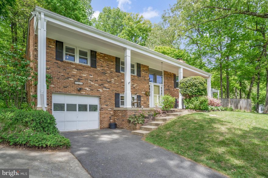 Great opportunity to purchase a newly updated 5 bed, 3 bath home on a 1/2 acre lot in the sought after neighborhood of Mantua located in Fairfax, VA. This split-foyer home with addition is located on a quiet no-thru street and boasts 2 levels of living, covered front porch, and impressive backyard. This is one of the most fun streets in Mantua best known for their Halloween decorations and festivities! The entire home is freshly painted, newly refinished hardwood floors on the main level, and new LVT flooring on the lower level. Large driveway with wraparound driveway for easy unloading of your car after grocery shopping and one-car garage. Spend time on the main level in your large family room with gas fireplace and picture window overlooking the front yard and beautiful landscaping. Step directly into your spacious eat in kitchen with recessed lighting, built-in shelves, wine rack, beverage cooler, and vaulted ceiling. Stainless steel appliances including newer wall oven (2023) and dishwasher (2022). Stove cooktop on the island with a wall oven and built-in microwave. Access your picturesque, fully-fenced back yard with deck, patio, and raised garden beds via your screened in porch with tile floor or sliding glass door - a truly seamless integration with the surrounding mature vegetation of the Mantua neighborhood. The main level has 3 bedrooms and two full baths including the primary bedroom with 2 closets and ensuite bathroom. The lower level has a large rec room with built-in shelving and large gas fireplace, 2 bedrooms, 1 full bath, laundry room, and large multi-use room with outside exit that would be perfect for storage or a home gym. Laundry room has front-loading washer and dryer, utility sink, and new water heater (2024). Access to the one car garage with additional built-in storage from the lower level. The neighborhood of Mantua is truly special, conveniently located to everything in the DMV, with much desired schools, community pool and tennis club and miles of walking trails.