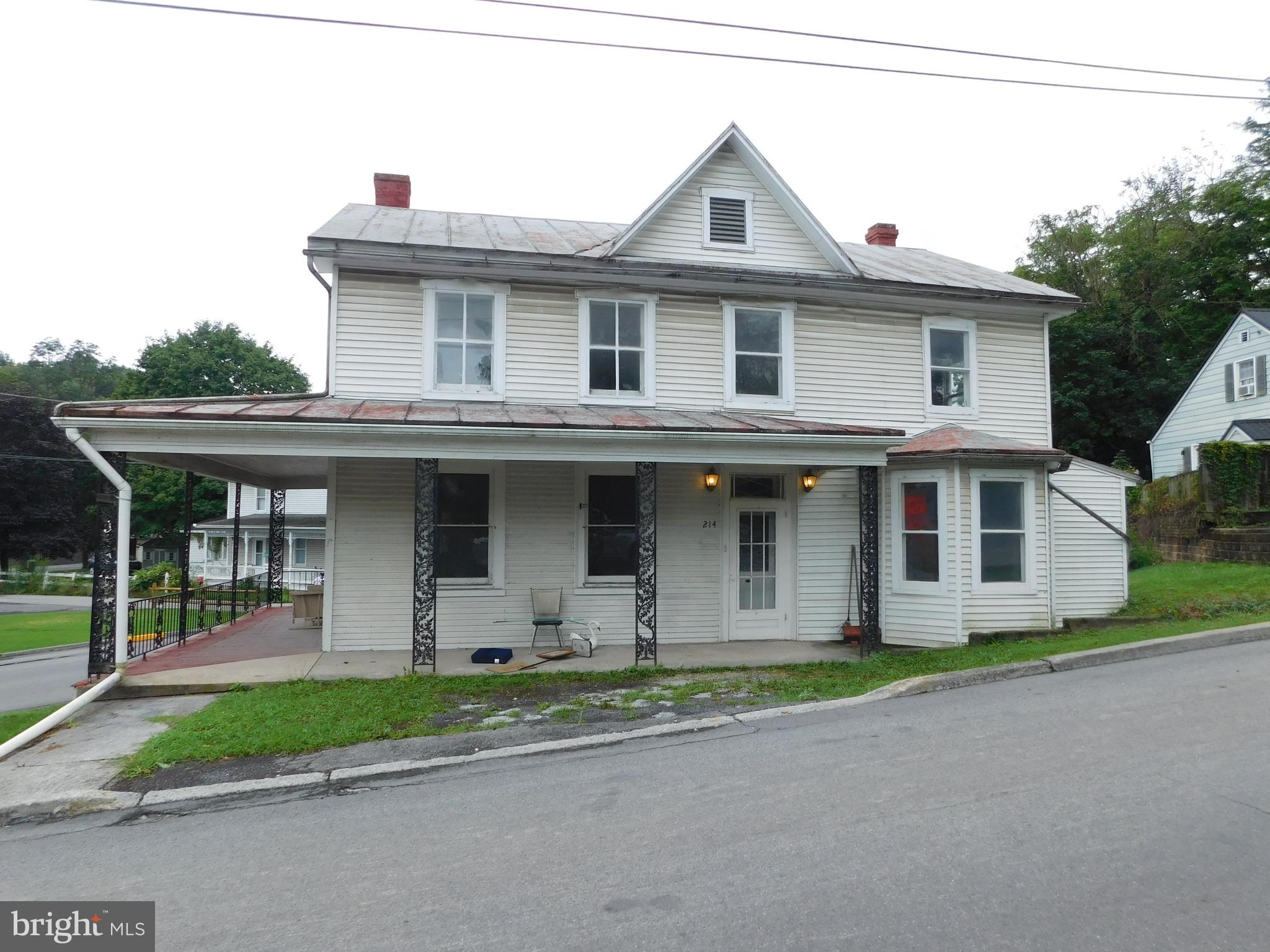 lots of storage in this house that needs a little TLC; wood floors & large rooms. there is an oversized 4 car detached garage; could be used for cars or storage (has electric to it).