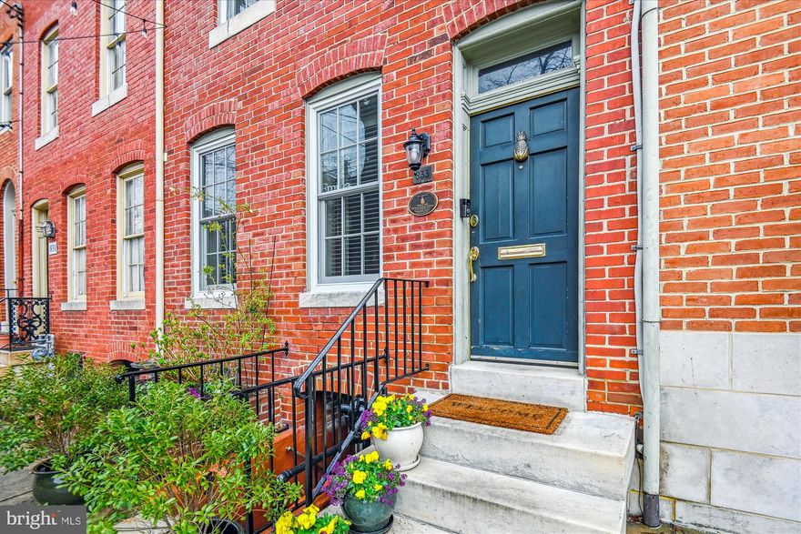 Welcome to 833 William Street - located on one of the premier blocks in the Federal Hill Historic District, just one block to the Inner Harbor and around the corner from Federal Hill Park. Step inside this unique 4-story home that has the option of two separate residences. The main level offers a den, parlor/office with a wood-burning fireplace, kitchen, bedroom, and full bathroom. It connects with the lower level with an additional bedroom and a full bathroom. Combine these two levels into an Air B&B, a place for visiting family, an au pair suite, or a Pied-a-Terre. The 2nd level has a huge living room, with built-in bookcases that flank the wood-burning fireplace; a dining room; renovated kitchen with an abundance of storage space and access to the wonderful and large composite deck out back;  plus a half bath. Head to the 4th floor & there you will find the beautifully renovated primary suite with custom closets. This retreat has a private sitting room that is perfect for relaxing or working out. The primary bath has a steam spa shower, heated floors, and a towel rack. Upgrades include recently replaced windows on the front and carpeting on the lower and main levels. Perfect for a multi-generational household or looking for some rental income! It is also conveniently located close to the newly renovated Cross Street Market, I-95, Camden Yards/M&T Bank Stadium, the MARC train for easy travel to Washington DC, and BWI airport.