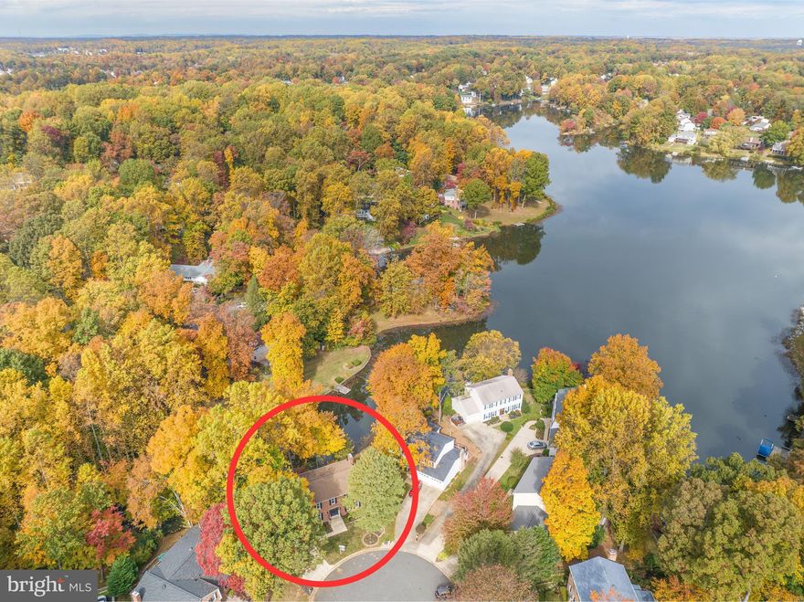 Stunning QUALITY renovation, RARELY-AVAILABLE LAKEFRONT property in Award-Winning Montclair Community. WATERFRONT HOME with Private 8 X 16 Dock on Lake Montclair!  Lake Montclair is a man-made 109 Acre lake with approx 200 private docks and 3 community docks.   This 3300+ Sq Ft 5 Bed/3.5 Bath is newly renovated top to bottom! Situated on a quiet cul-de-sac, this home’s curb appeal screams MAJESTIC and boasts a fresh new paint scheme and new vinyl clad Energy Efficient windows...what fun to dress this beauty up for the holidays! Once inside, prepare to be amazed at every turn. Gorgeous brand new natural oak hardwood flooring runs throughout the main floor and carries up the stairs, upper hall and Primary Suite. Check out this piece of retro in the hallway...the 1976 lighted doorbell cover was refreshed with a custom-designed stained glass piece of art created by a Veteran to evoke the vibe of this lakefront property. The flow of the home was modernized by removing walls, raising entryway ceilings & removing soffits. Although you'll be drawn to the kitchen, make sure to stop by the glamorous powder room first. The entire showcase kitchen is outfitted with new HIGH QUALITY Brightwood Custom solid wood cabinets with dove-tail joints and soft-close hinges in  elegant black with brushed gold fixtures. A TEN FOOT ISLAND offers plenty of space for gathering. The counters are Exotic Piana Quartz with a pale gold vein that plays perfectly with the marble backsplash. The ornate custom vent hood with gold trim and the potfiller over the stove add form and function to this captivating space. The kitchen is flanked on the opposite wall by gorgeous built-ins with subtle accent lighting that surround the wood-burning fireplace. The recessed lighting throughout the home can be adjusted to any tone of light you wish, and are all on dimmer switches to suit the mood. The view from the family room is spectacular! The neighboring trees frame the glistening lake as if it were your personal magazine cover.  The upper deck is a composite surface for low maintenance and is plenty large for your outdoor dinner parties. You'll see the hardwood flooring is continued upstairs through the hallway and primary suite, which features an en suite bath in calming tones of blue and grey, custom tile work, a large walk-in shower, dual-sink vanity and glittery chrome fixtures.  It also has a walk-in closet with custom shelving. The Hall Bath has attractive tile floors, a custom tub-surround, a dual-sink vanity and brushed nickel fixtures. All four bedrooms are outfitted with ceiling fan/light fixtures that can be controlled by light switches or a remote. A large linen closet and the Laundry closet are conveniently located on this level as well.  The Hardwood stairs carry to the lower level and tie into the waterproof Luxury Vinyl Plank flooring in the Rec Room. The large light-flooded Rec Room features VIEWS OF THE LAKE, a SECOND brick fireplace,  and access to the lower-level deck.  On the other side of the lower level there is a large 5th bedroom with lake views and another full bath. Plenty of unfinished storage space as well and more storage in the extra deep garage. Stairs out back lead to your private 8X16 dock. MUST SEE!! Montclair amenities include your 109-acre stocked lake with 3 sandy beaches, boat ramp, boat storage, fishing piers, playgrounds/tot lots, ball fields, exercise stations, new dog park, 18-hole golf course with full-service Country Club, ...the list goes on! Pool memberships available too. Easy access to I-95 and nearby commuter lots/buses make it easy to commute to DC, the Pentagon, and beyond. Special financing is available through Project My Home to save you money on closing costs. Home is currently enrolled in a premium home warranty with the option to transfer to buyer at closing.