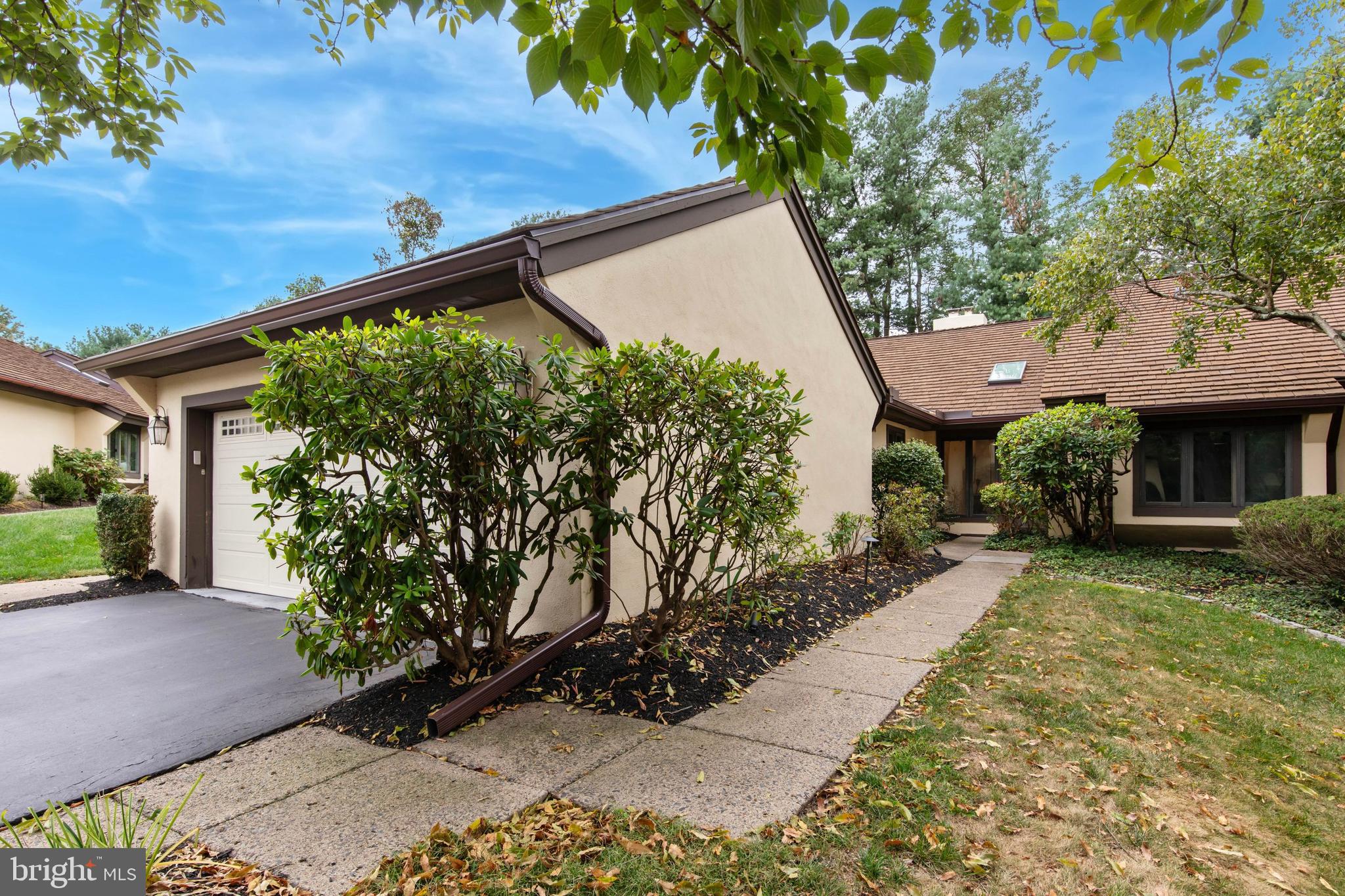Welcome to 6 Steeplechase Lane, a beautifully maintained 3 bedroom 2 bath end unit home featuring a 2 car garage nestled within the prestigious Whitpain Farm over 55 gated community. This development sits on 120 acres of lush, landscaped grounds located in the heart of Blue Bell. Enjoy the ease and peace of mind that comes with living in this sought-after 55+ community. This expanded Narcissa Model features 2,300 square feet of bright and spacious living, including a delightful sunroom/den with casement windows that opens to a large private patio with serene views of the beautifully manicured grounds. The elegant living room features gleaming hardwood floors and a cozy gas fireplace, seamlessly flowing into the formal dining room with a lovely bay window. The sunroom/den provides additional living space and the perfect spot to relax or entertain, surrounded by lots of natural light and views of the lush landscape. The kitchen is a chef’s delight, boasting upgraded Wood-Mode cabinetry, granite countertops, stainless steel appliances including a newer JennAir dishwasher, Sub-Zero refrigerator, stylish backsplash, and updated flooring and a charming breakfast area. Retreat to the luxurious master suite complete featuring a nice sized walk-in closet plus additional closets, a private dressing area and a sumptuous master bath featuring a jetted soaking tub, a spacious shower and an oversized vanity. You'll also find two additional nice sized bedrooms and a beautifully updated hall bath. Additional highlights include a main-level laundry room with access to the two-car garage plus a partially finished basement ideal for extra living space with ample storage.
Ideally located near top-rated Blue Bell restaurants, Wentz Run Park, and major highways, this exceptional home offers the perfect combination of luxury, comfort, and convenience. Simply move in and start enjoying the wonderful amenities, including a sparkling outdoor pool, two tennis courts, a community garden, and the stately Manor House—perfect for hosting gatherings, parties, and game nights.
Come tour this lovely home today and discover the relaxed lifestyle that awaits you at Whitpain Farm.