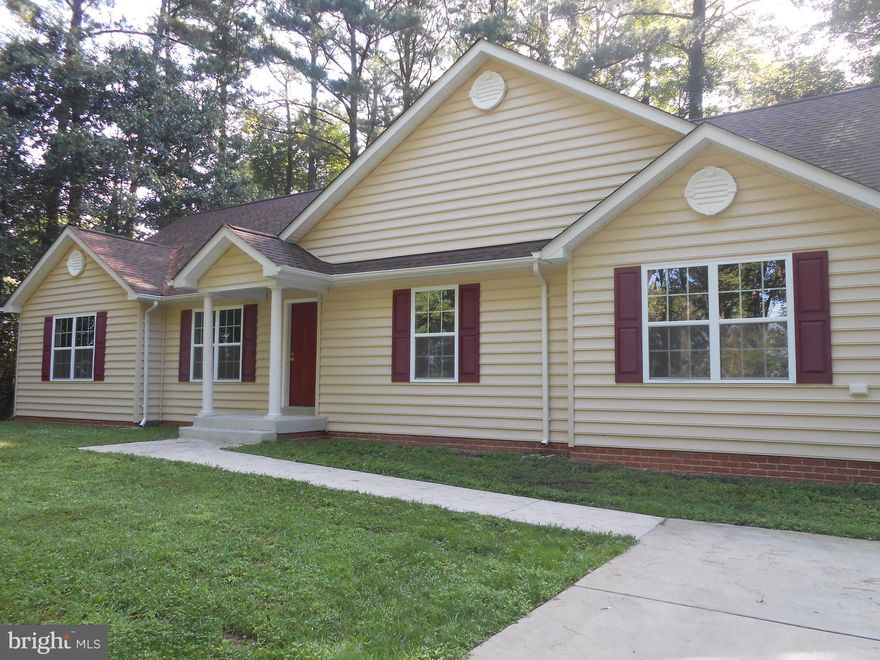 Beautiful 7 year old rambler.  All hardwood floors, 3 bedroom 2 full bath, gas fireplace, deck, tankless hot water heater, concrete driveway in a water access community. Very nice.