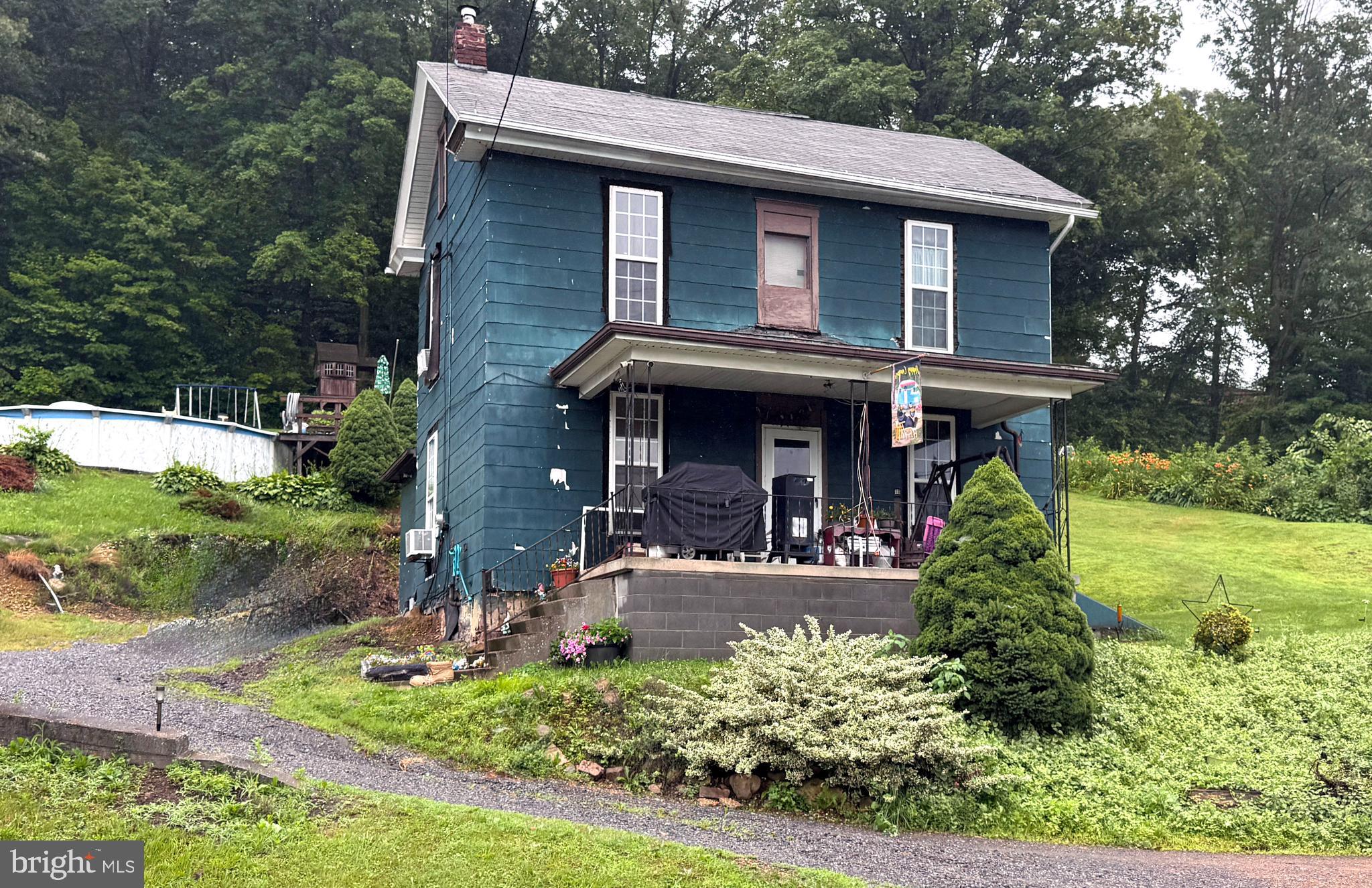Endless Possibilities in a Scenic Setting. Surrounded by natural beauty and backed by PA State Game Lands #278, this unique offering includes 4 parcels totaling 1.57 partially wooded acres in the Tyrone School District, an ideal opportunity for nature lovers, hunters, investors, or anyone with a creative vision. Enjoy direct access to 1804 acres of protected land perfect for hunting, hiking, birdwatching & soaking in the serenity of the great outdoors. Take in peaceful views of neighboring mountain ranges right from your covered front porch or cool off in the above-ground pool on warm summer days. Conveniently located just under 4 miles from I-99, you'll appreciate the easy commute to both State College and Altoona, all while enjoying the quiet and privacy of country living on the outskirts of Tyrone. The property includes a 2-bedroom, 1-bath two-story home as well as a mobile home, providing flexible living arrangements. Live in one and rent out the other, rent out both, or reimagine the space entirely, the potential is yours to unlock. Whether you're looking for a private getaway, an investment opportunity, or a project with promise, this property offers room to grow and a setting that’s hard to beat.. Your next adventure starts here.