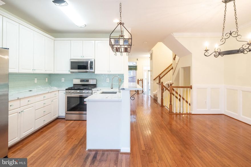 This end-unit townhome in the heart of Ballston combines modern style with unbeatable convenience. The remodeled kitchen boasts high-end quartz countertops, a sleek glass tile backsplash, a new sink and faucet, and an extended countertop bar. Hardwood flooring, spacious bedrooms, and large windows enhance the open floor plan, creating light-filled living throughout. Located minutes from Ballston Metro, shopping, dining, and entertainment, this is urban living at its best. Enjoy effortless commuting to DC, Pentagon, or Tysons while being surrounded by Ballston’s top restaurants, shops, and entertainment. No smoking; pets welcome case-by-case.