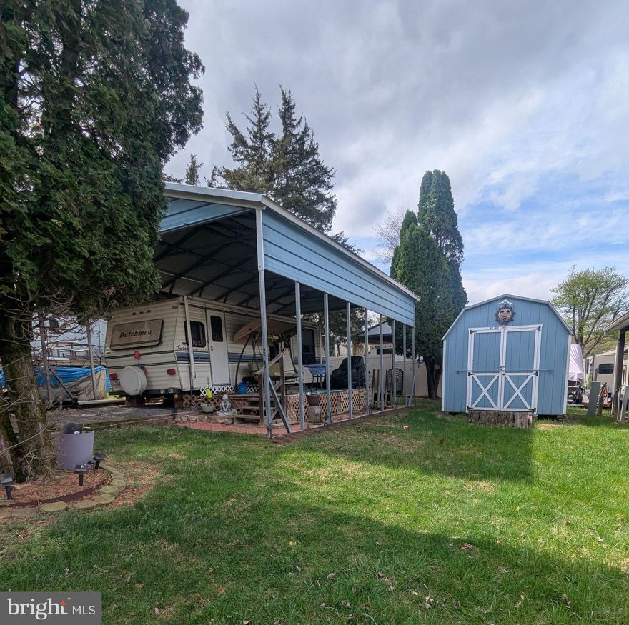 Let's bring an offer to the table! This lot features a Dutchman 26' camper, perfect for those who love a cozy retreat while enjoying the great outdoors. In addition to the camper, the property includes a deck, and a pavilion ideal for gatherings or relaxation, and a handy shed for all your storage needs. Plus, you'll be treated to partial views of the river, adding a touch of serenity and natural beauty to this inviting space.

**Members Enjoy:** - Amazing views and wildlife - Access to the Potomac River - Trails for hiking and walking - Swimming pools - Mini-golf - Youth center - Tennis and basketball courts - Laundry facilities - Convenience store, deli, and lounge Additional amenities include bathhouses throughout the park, a boat ramp, a bar and grill, and even a church on the grounds. River Bend also hosts numerous activities such as fireworks on the 4th of July, a small carnival, bonfires, poker runs, horseshoe tournaments, a car show, Halloween trick-or-treating, and much more.