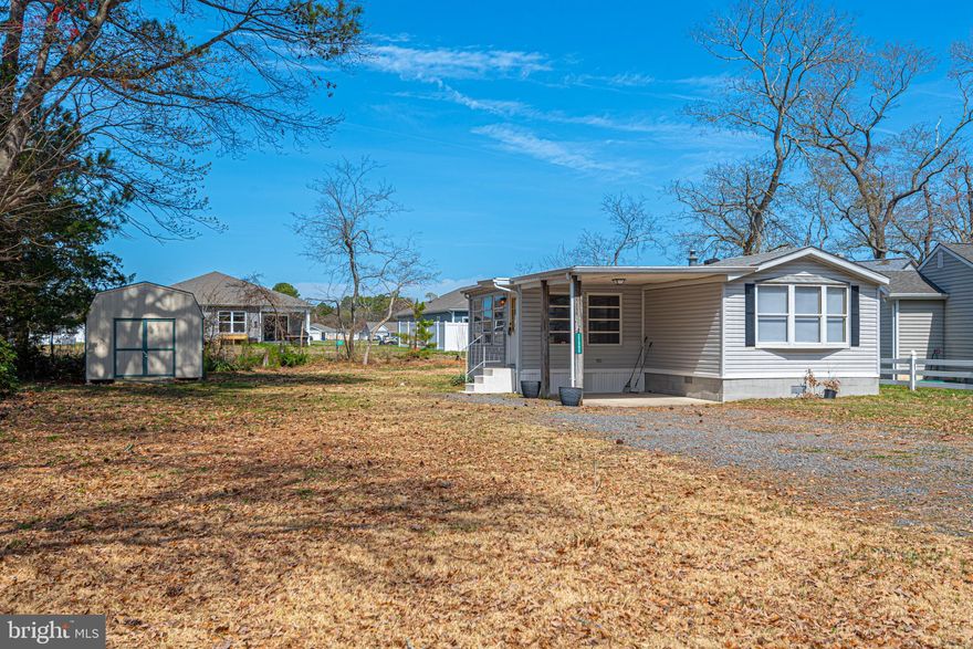 Welcome to 32996 Circle Drive in Millsboro! An opportunity to own your land and enjoy coastal living without the added expense of ground rent or HOA. This 2-bedroom, 2-bath single-wide mobile home is set on a spacious 0.26-acre lot and offers a functional open floor plan with a seamless flow between the living room, dining area, and kitchen—with brand new LVP flooring throughout! The kitchen features a pantry, built-in cabinetry, and ample storage, while the primary suite offers a generously sized closet and private bath for added comfort. Step outside and you’ll find multiple areas to enjoy the outdoors, including a covered patio and three-season porch—perfect for relaxing after a day at the beach. The property also includes a large shed, stone driveway, and plenty of space to create your own backyard retreat. Located in the Orchard Manor area, this home is just a short walk to the Indian River Bay and nearby local dining, offering that laid-back coastal lifestyle buyers are searching for.  Whether you’re looking for a primary residence, vacation home, or investment opportunity, this property delivers affordability, flexibility, and proximity to the Delaware beaches—just a short drive to Bethany and beyond.