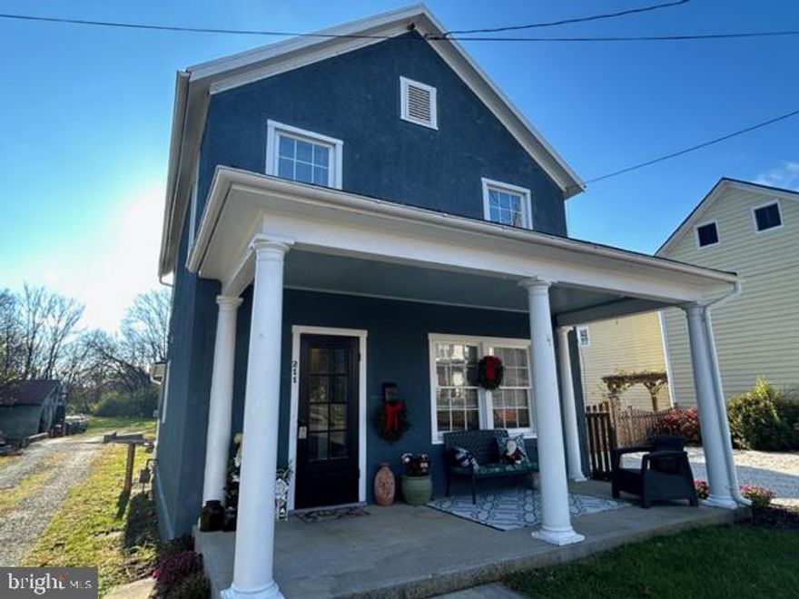 We have the amazing opportunity to have listed this wonderful example of a " Shotgun Home" on Main St. in Berryville. The full front porch welcomes you and when inside you'll be standing in a center hall with  a lovely staircase that has 6" base molding and special original woodwork.  The ceilings are high and the rooms are a very good size. Nothing has been taken away from its original charm.  The home is is very good condition and just waiting for a new owner to appreciate it.  Upstairs there are three great bedrooms and a cozy nook for a book at the end of the hallway. There is  a formal dining room  and a laundry room with lots of shelving as well. The enclosed porch  could be used to expand the finished living space. The yard has a water feature as The picturesque town run, runs through it. It is full of minnows. Within walking distance to schools, parks, shops & restaurants, Welcome to small town living at it's best!