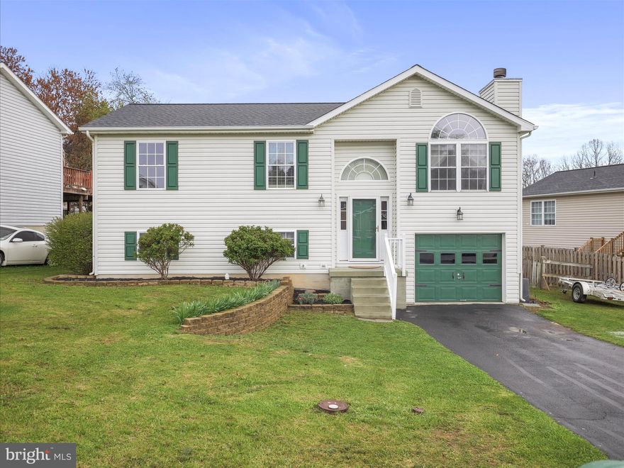 Charming Home with Original Hardwood Floors & Finished Lower Level!  Welcome to this beautifully maintained home featuring original hardwood flooring throughout most of the main level. With warm, neutral wall colors that create a welcoming atmosphere, this home is both stylish and comfortable.  The finished lower level offers additional living space, perfect for a family room, home office, or playroom, and includes a full bath for added convenience.  Step outside to a spacious back deck—ideal for entertaining or relaxing while enjoying the fresh air. The flat backyard provides plenty of room for gardening, outdoor activities, or simply unwinding in a private, peaceful setting.  New roof was installed in 2023, providing peace of mind for years to come and a flat driveway and attached garage offer easy parking and storage.  Don’t miss out on this incredible opportunity to make it yours!