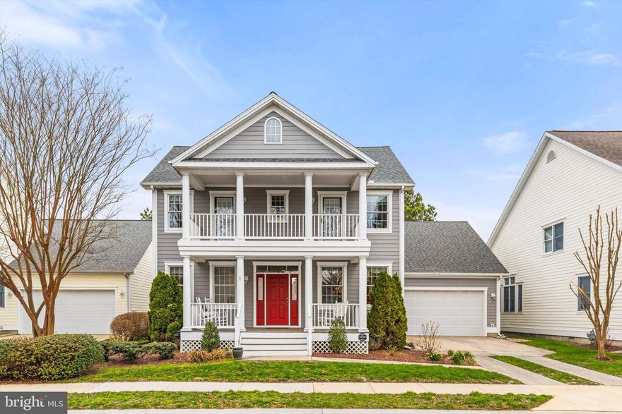 Immaculate and beautifully maintained, this charming 4 bedroom, 2.5 bath home offers panoramic golf course views, double front porches, and exceptional indoor and outdoor living in the sought after community of Bear Trap. From the moment you arrive, the stunning exterior and welcoming porches set the tone for the charm and character found throughout the home.

Inside, you’ll find a bright, open floor plan with lovely architectural details including arches and columns, and a dramatic two-story great room with fireplace overlooking the golf course. The home offers a living room, dining room, breakfast room, and a huge screened porch...perfect for relaxing or entertaining.

The spacious first floor primary suite features engineered hardwood floors, double closets designed by California Closets, and a large bath with separate vanities, oversized jetted soaking tub, walk-in shower, and linen closet. Upstairs, a loft area provides additional living space, along with two bedrooms connected by a shared bath. Both with access to the front porch. An additional cozy bedroom offers the perfect space for guests, a home office, or den.

This home has been exceptionally well cared for with major updates already completed, including a new roof (2022), two natural gas HVAC systems (2023), and gas hot water heater (2021). Additional features include an encapsulated crawlspace, built-in cabinetry, laundry room with sink and cabinets, attic storage, outdoor shower with dressing area, stone paver patio/walkway, irrigation system, alarm system, maintenance-free front porch, gas line for grilling, and a 2 car garage.

Located just a short stroll to the community amenities, Bear Trap is a one-of-a-kind community offering 27 holes of championship golf, an on-site restaurant, beach shuttle to Bethany, indoor and outdoor pools, fitness center, tennis, pickleball, and more. The low HOA fee for single family homes includes cable TV, internet, trash and recycling, and use of amenities (golf is separate). Conveniently located just 3 miles to the beach.

This is the kind of home everyone hopes to find...pristine, lovingly maintained, and ready for its next owner.