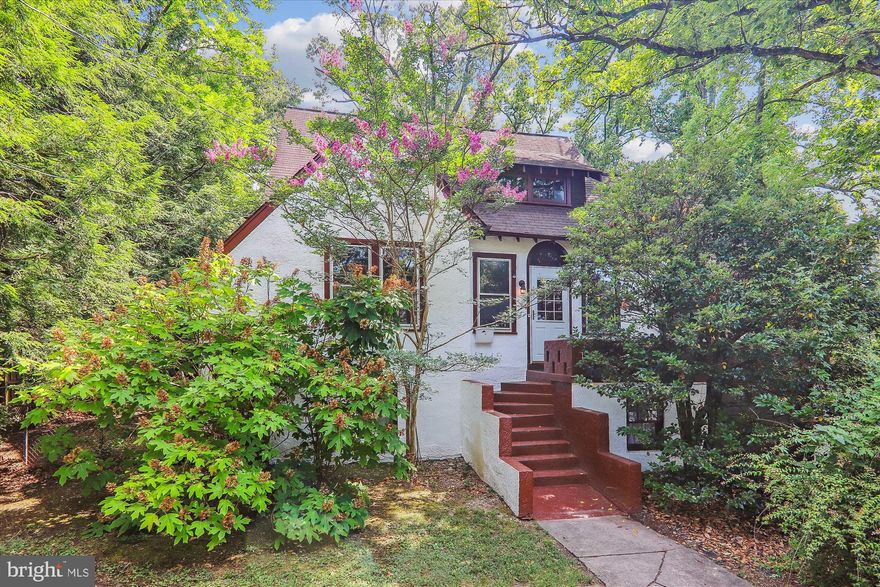 First time on the market in 70 years!  With over 4000 (est.) square feet of living space, this unique storybook cottage, nearing 100 years old, is situated on almost .4 acres in the Hyattsville Historic District and has retained its old world charm. The original hardwood floors, wood trim and brass and glass doorknobs throughout cannot be replicated in this day and age.  As you enter through the front door into the over-sized living room you will see the natural light coming in through the Palladian windows in the sunroom.  Access the large porch overlooking the Koi pond from the French doors in the formal dining room.  The eat-in kitchen boasts the original farmhouse sink and cabinets that reach to the ceiling.  The main level  is also host to two more bedrooms, a cozy den with fireplace (could be used as a sixth bedroom) and a full bath.  The upper level is home to three more bedrooms, some with built-ins, another full bath, large closets and storage areas, and additional living space that could be used as a home office among other things.  The lower level completes the home with a recreation room, family room with second fireplace, laundry room, third full bath, garage, workshop and even more storage (unusual for a house this age).  Convenient to University of Maryland, Metro, 495, 95, B/W Parkway, shopping and restaurants.  Home is being sold As-Is.