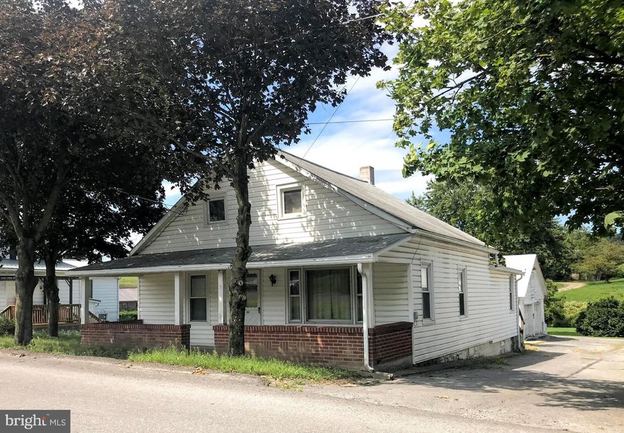 With a little love this charming 1-1/2 story home could be made a beautiful once again! Make it your own with some updating and renovations! This home has an extra large lot and a 1500 square foot garage, something for everyone!