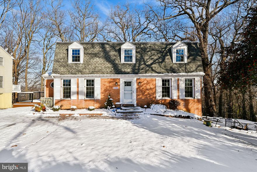 Brick-front Dutch Colonial with 4 bedrooms and 2 full bathrooms, ideally located in coveted West Towson. Updated in 2018 , the spacious kitchen features an island/breakfast bar, GE stainless-steel appliances, granite countertops and a window seat. The kitchen  opens  to a family room with a fireplace flanked by built-in bookshelves. Laundry /mud room off of the kitchen. Hardwood floors on both levels.  A front foyer with designer wallpaper, formal dining room, large LR with 5 windows and a powder room complete the main floor.  2nd floor bedrooms are generously sized with ample closet space. Major updates include a new roof ,new kitchen, new windows (2020) HVAC 2008 Hot Water heater 2019. Hall bathroom 2024.    Enjoy outdoor living on the recently updated composite deck, overlooking the twinkling lights of Towson. The finished lower level offers space for a pool table, seating area, and a storage  room with shelving.
The hall bathroom has been recently and tastefully updated with custom tile. Two outdoor living spaces include a deck and a stone patio with café lights. Conveniently located close to schools, shopping, and transportation. Zoned for West Towson Elementary, Dumbarton Middle, and Towson High School.