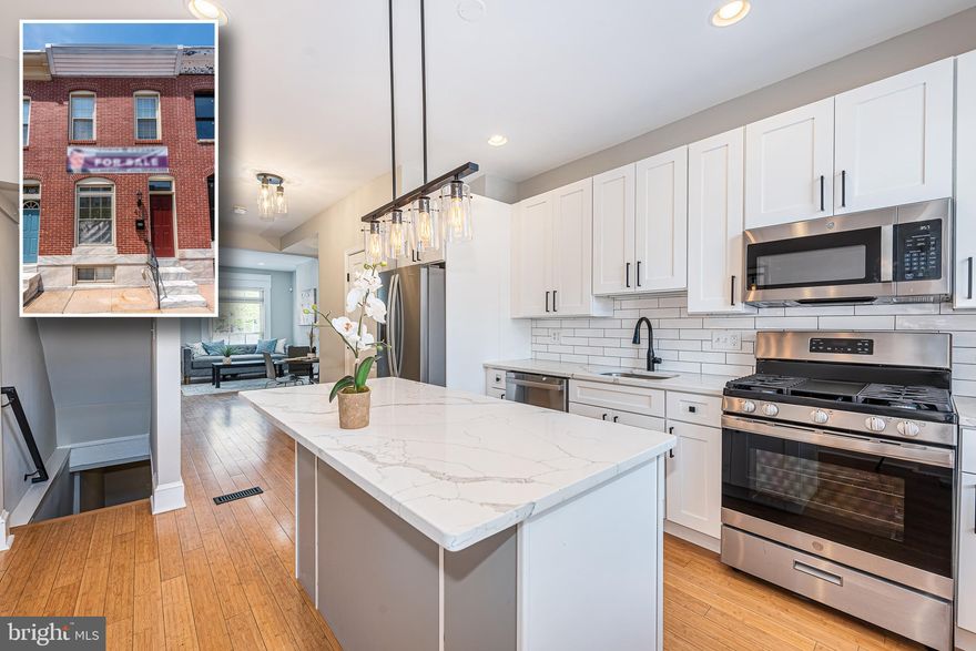 PICTURE PERFECT PATTERSON PARK ROWHOME WITH 3 FINISHED LEVELS!  Features include an open floor plan with gleaming hardwood floors throughout the main level, an inviting living room, separate dining area, new designer island kitchen with ss appliances, Quartz counters, & tile backsplash, main level half bath, upper level with 2 generously sized bedrooms and a hall bath with a separate whirlpool tub and separate shower, a finished basement with a large family room and laundry/storage room, and a rear paver patio with a privacy fence.  Pack your bags and move right in!