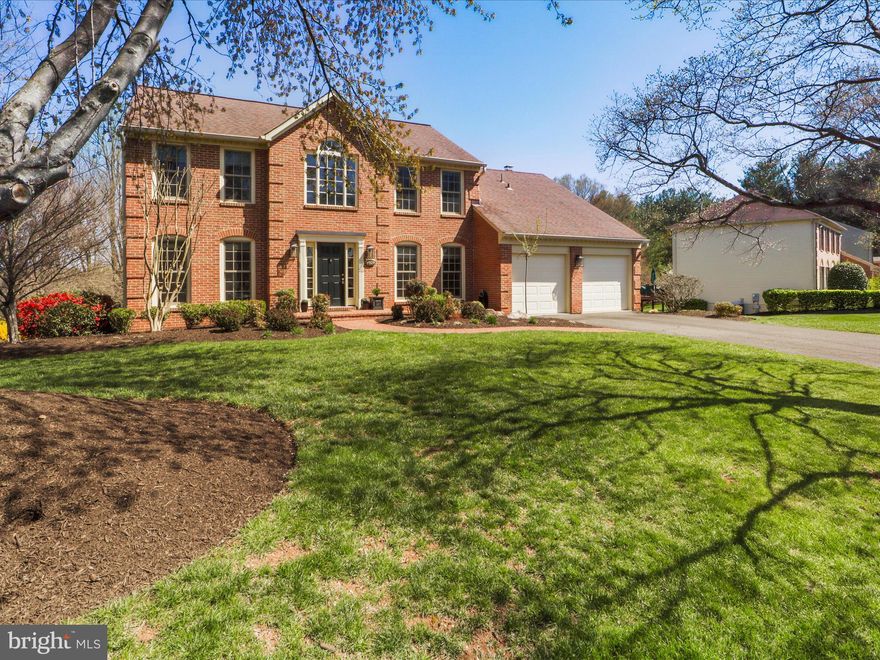 Welcome to Your Dream Home in Wolftrap Meadows, Vienna, Virginia!  Prepare to be captivated by this beautifully updated 5-bedroom, 3.5-bathroom stately brick-front colonial nestled on an expansive .75-acre lot in the highly sought-after Wolftrap Meadows community. With its tasteful updates, impeccable care, and prime location, this home is truly turn-key and ready for your family to move in.  From the moment you arrive, you’ll fall in love with the home’s undeniable charm. A beautifully manicured lawn and extensive landscaping frame the elegant brick walkway and stoop that lead to the inviting front entrance. The two-story foyer greets you with a sense of grandeur, setting the tone for the sophistication within.  Genuine hardwood floors flow throughout the main level, enhancing its timeless appeal. The formal dining room, adorned with wainscoting and crown molding, is perfect for hosting special occasions. The gourmet kitchen is a chef’s delight, featuring rich dark oak cabinetry, stainless steel appliances, granite countertops, and a center island. Adjacent to the kitchen, leading to the garage is a large mudroom/laundry room, complete with cabinets for added storage. The built-in breakfast nook offers a cozy spot for casual meals and morning coffee.  Connected to the kitchen is the family room, the heart of the home, with its gas fireplace boasting a brick surround and mantel. Brand-new plush carpeting adds a touch of luxury to this inviting space. The seamless open-concept layout between the kitchen and family room is ideal for entertaining and relaxing by a cozy fire. From the family room, sliding glass french doors lead to an expansive composite deck, almost maintenance-free and designed for years of enjoyment. Here, you’ll relish serene views of the fully fenced backyard, which is spacious enough to accommodate a pool or sports court, offering endless possibilities. Backing to lush trees, it provides privacy and a peaceful connection to nature. The lot even expands beyond the fence line, with mature trees creating outstanding views and a sense of serenity. Picture al fresco dining, grilling, and gatherings with family and friends in this extended outdoor living space.  The upper level is a true haven of comfort and luxury. The expansive primary suite offers a tranquil escape, featuring two spacious walk-in closets and a spa-like ensuite bathroom complete with a frameless glass shower, jetted tub, and dual vanity sinks. The additional bedrooms on this level are generously sized, each with ample closet space, providing flexibility for family, guests, or hobbies. Completing this floor is a fully renovated hall bathroom that exudes modern style and functionality, ensuring every detail has been thoughtfully considered. The walk-out lower level offers endless possibilities. With a large open layout, wet bar, fully renovated bathroom, and a spacious storage room, it’s perfect for entertaining or creating an in-law or nanny suite. The fifth bedroom provides private accommodations, while sliding glass doors lead directly to the backyard, seamlessly blending indoor and outdoor living.  All bathrooms have been tastefully updated in recent years, ensuring modern comfort and style throughout.  2023 WATER HEATER, 2022 TREX DECK, 2018   FURNACE & A/C , 2012 ROOF. This home has been meticulously maintained and cared for, offering peace of mind for the next lucky owner.  Wolftrap Meadows is a vibrant, family-oriented community known for its friendly atmosphere and  neighborhood events including the annual halloween parade . You’ll enjoy proximity to major routes, making commuting a breeze, as well as easy access to Vienna & Tysons Corner, where you’ll find an abundance of shops, restaurants, and amenities. Outdoor enthusiasts will appreciate the nearby trails, paths, Meadowlark Botanical Gardens and Vienna festivals This lovely gem offers the perfect blend of elegance, comfort, and convenience all wrapped into one!