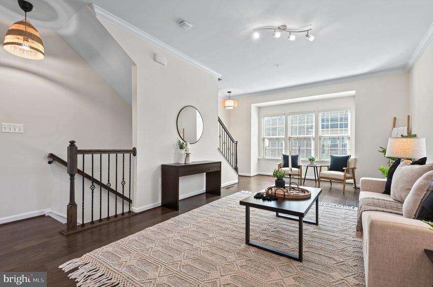 Welcome to Eager Park Townhomes, where contemporary living and ultra convenience intersect! This end-of-group home is full of light, and one of the largest layouts in the community. Formal living room with powder room on the entrance level. Huge, open entertainment space on the main level with large patio. Never stress about parking, with an attached garage and additional parking pad. Eager Park is contiguous to The Johns Hopkins Hospital campus, and benefits from multiple levels of security including private security, Hopkins Security and foot patrols. Low $50 monthly HOA fee covers lawn maintenance (mulching), snow removal and common areas. Part of the Eager Park Neighborhood Association, which hosts concerts, movie nights and other socials. Come be a part of this expanding community, that soon will be breaking ground on 64 new units. Eligible for a substantial Live Near Your Work grant.