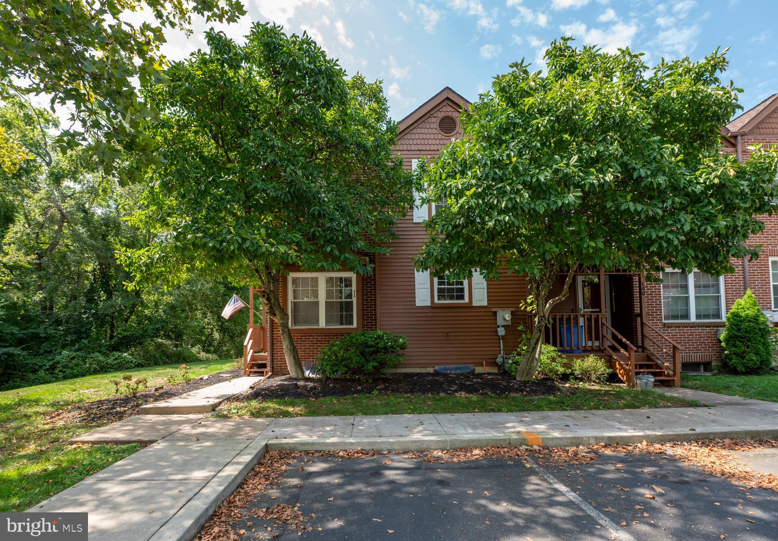 Fabulous 3-bedroom, 2 ½-bath end-unit townhome in the highly sought-after Perkiomen Woods community! NEW! NEW! NEW! This beautifully renovated home features a brand-new slider and private deck, a brand-new powder room vanity, fresh paint, and all-new carpeting throughout. Gleaming hardwood floors span the entire first level, beginning in the welcoming foyer that flows into a bright breakfast room and an absolutely stunning gourmet kitchen with soft-close cabinetry, newer appliances, and hardwood flooring. The kitchen opens seamlessly into the formal dining area and spacious living room, highlighted by a cozy wood-burning fireplace and access to the expansive private deck—perfect for entertaining or relaxing with serene wooded views that provide rare privacy in a townhome setting. Upstairs, the primary suite impresses with vaulted ceilings, dual skylights, closet organizers, and a full ensuite bath. Two additional generously sized bedrooms, a hall bath, and a convenient upstairs laundry complete the second level. The fully finished basement adds versatile living space along with ample storage. Perkiomen Woods residents enjoy fantastic amenities including a pool, clubhouse, tennis courts, and a playground. Ideally located just steps from the Perkiomen Trail and minutes to Providence Town Center with Wegmans, Movie Tavern, shopping, dining, and easy access to Route 422. All this in the award-winning Perkiomen Valley School District!