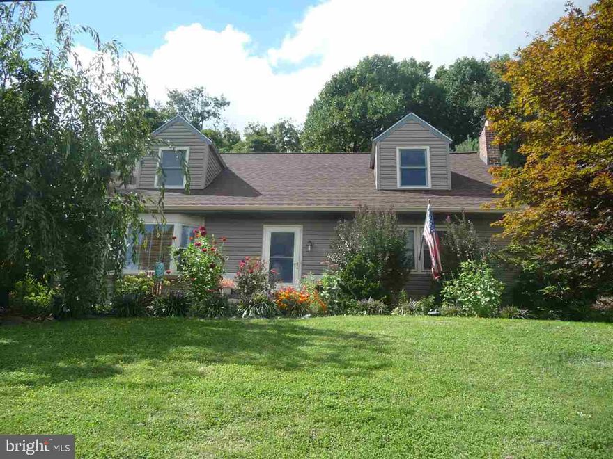 Cape cod on almost 1 Ac Lot. Beautiful remodeled kitchen with hickory cabinets, granite counters, and large breakfast bar. Living room with new bay window and country views. 2 BR on first floor, bath with tile walk-in shower, and 2 BR on second floor with full bath. Partially finished, walk-out lower level could be additional living area. Great outdoor space with 2 landscaped paver patio areas, and a 20 x 20 workshop with electric and heat.