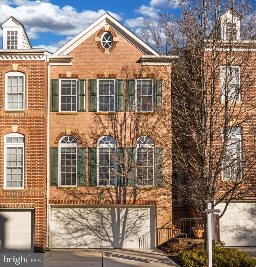 Luxury 3 level 2 car garage Townhouse with everything- Hardwood Floors, floor to ceiling windows,Master suite with spa bath,Gourmet eat in kitchen with island and breakfast bar open to family room! 2 full & 2 half baths in 2237 sq ft above grade, Formal main level rooms & Trex Deck off kitchen and family room backs to trees! Large lower level Rec Room with half bath, gas fireplace and built-ins!