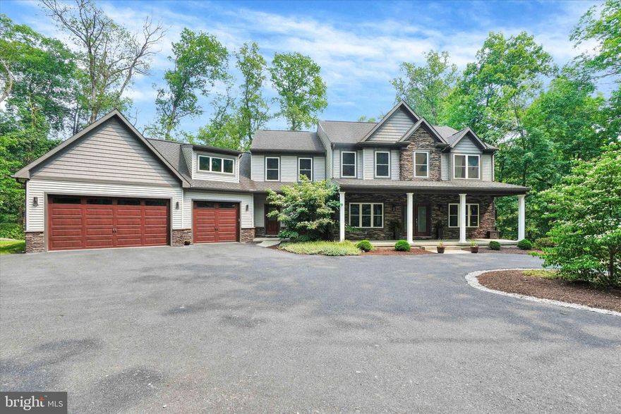 Welcome to a luxurious 4200+ sqft home, combining elegance and comfort amidst natural beauty/  4 bedrooms plus an office on the first floor that can convert to a bedroom.  2 full bathrooms with the option to add a shower in the lower level half bath.  Sunken family room with a gas fireplace and floor to ceiling oversized windows. Gourmet Kitchen with  upgraded appliances, wine fridge, touchless faucet,  Granite countertops, oversized range, and additional wall oven. Primary Suite has Vaulted ceiling & custom walk-in closets.  Spa-like Primary bath with soaking tub, large shower, heated towel rack. Finished basement with a full granite wet bar and stone accent wall.  Heated 3-car garage with basin sink, fridge, and attic storage.  Mudroom with lit coat closet and walk-in storage pantry. 7.5 acres of private wooded property with a creek and bridge.  Astroturf putting green, firepit, and room for a pool and deck.   Just two miles from town, offering seclusion and convenience.  Schedule a tour and see how this home fits your lifestyle. 
 Don’t miss this extraordinary opportunity to own a home that promises both luxury and a connection with nature. Make this dream home yours today!
Negotiable items: Side by Side Gator & Golf Simulator.