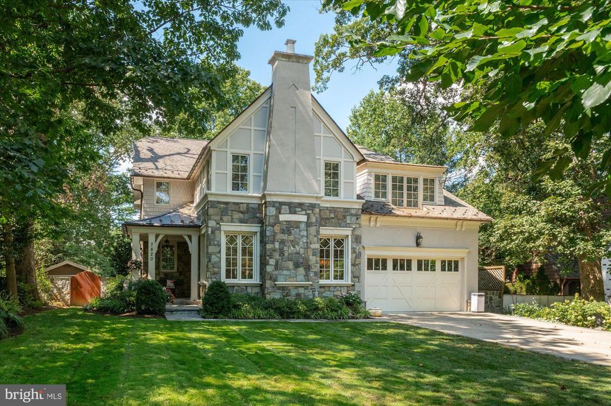 Timeless Elegance, Masterfully Designed, Fully Updated! Welcome to 7820 Hampden Lane—an award-winning, Studio Z-designed stone Tudor nestled in the picturesque Greenwich Forest neighborhood. This refined and architecturally distinctive custom home offers over 6,700 square feet, four generously sized bedrooms, one optional additional bedroom, four full bathrooms, and a powder room across three beautifully finished levels. Set on an 11,488 square foot lot in one of Bethesda’s most desirable neighborhoods, this exceptional residence showcases breathtaking details throughout, including high ceilings, rich wood flooring, intricate moldings, tray and coffered ceilings, abundant natural light, Plantation shutters, four gas fireplaces, and classic Tudor-style windows with diamond-over-rectangular patterning. Recent upgrades include new roof, new upper-level HVAC, and hot water heater. 

A professionally landscaped yard with stone accents and an enchanting covered front porch—paired with an impressive wood door with etched glass—sets the tone for this remarkable home. Inside, you’ll find a grand entry foyer, an elegant living room with a gas fireplace and crown molding, and a state-of-the-art chef’s kitchen that flows seamlessly into the stunning family room with coffered ceilings, a gas fireplace flanked by custom built-ins, and access to the covered rear deck. Additional main-level highlights include a butler’s pantry with built-in cabinetry, a china closet, and a wine cooler, as well as a formal dining room adorned with shadowbox molding, woven grass wallpaper, inlay accent wood flooring, and a tray ceiling.

The fully updated and remodeled chef’s kitchen is the centerpiece of the home, featuring premium stainless-steel appliances, Taj Mahal quartzite countertops, an expansive island with breakfast bar, a professional six-burner Wolf range with custom hood, and an oversized Thermador refrigerator. It also includes a Thermador  wall oven for added cooking capacity, abundant prep space, glass-front display cabinets perfect for showcasing china, two Bosch dishwashers, elegant pendant lighting, a walk-in pantry, and a sun-drenched breakfast room that opens to the rear deck. The main level is completed by a private office, a powder room, a mudroom, and a walk-in closet, and a two-car garage.

Upstairs, the second level offers four well-proportioned bedrooms, three updated bathrooms, and a laundry room with built-in cabinetry. The impeccably appointed primary suite is a true retreat, featuring a private balcony, a corner gas fireplace, tray ceilings, recessed lighting, a ceiling fan, and two expansive walk-in closets with custom organizing systems. The luxurious primary bathroom includes double vanities, a soaking tub, and a separate shower with bench seating.

Two secondary bedrooms share a Jack and Jill bathroom and feature custom built-in benches and display shelving. A fourth en-suite bedroom includes a private bathroom and a walk-in closet. There is also a second-floor office with custom built-ins and a large picture window.
 
The amazing finished lower level includes a media room, a spacious recreation room with a Fieldstone gas fireplace, and a gorgeous wet bar with honed solid-surface counters, two beverage refrigerators, and a microwave. This level also features a fitness room that can be converted to a fifth bedroom with an exterior entrance, a full bathroom, a storage room, and a utility room.

The home sits on a picturesque lot enhanced by mature, professionally designed landscaping. Outdoor highlights include an inviting front porch, a serene flagstone patio, an expansive deck, a terraced backyard framed by lush greenery, and beautiful hardscaping with river rock accents.

Located just minutes from shopping, dining, and the vibrant energy of Downtown Bethesda, this home offers 
easy access to NIH, the Medical Center, and Bethesda Metro. Whitman HS cluster.