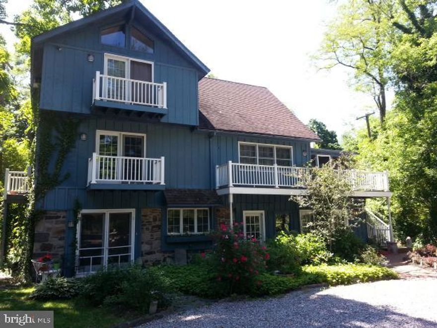 This charming three-story home is ideally located just a short walk from the lively center of New Hope Borough, where you can enjoy a variety of shopping, dining, and entertainment options. The property sits on a good-sized lot, offering a nice balance of space and privacy. The main level features a cozy screen porch that leads to the scenic trails of Delaware Canal State Park. Inside, the open-concept living and dining area includes a cathedral ceiling, large windows, and French doors that provide picturesque views of the Delaware River and canal. The second floor includes a loft area with access to a rooftop deck, perfect for enjoying the outdoors. The bedrooms are spacious with high ceilings and ample closet space. The master suite offers a peaceful retreat with lovely water views, making it an ideal spot to enjoy morning sunrises. The first floor includes a separate two-bedroom apartment with its own private entrance. This flexible space, featuring exposed river stone walls and its own laundry area, can serve as a rental unit, home office, or guest suite. The property also offers a detached two-car carport and additional parking for multiple vehicles. More details can be found in the seller's disclosure and attached documentation.