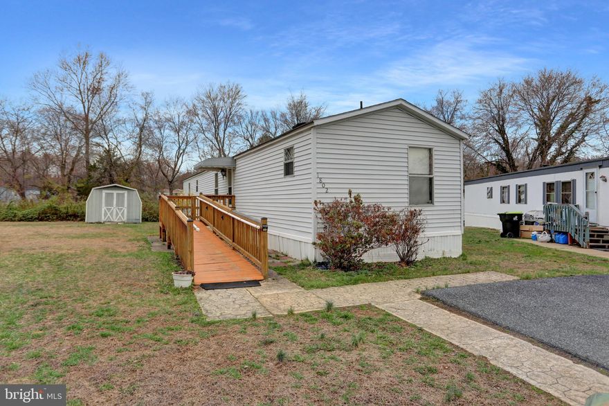 This 3 bedroom, 2 bath unit sits on a cul-de-sac and backs to woods and stream.   Spacious living room boast cathedral ceiling with decorative center beam,  separate Dining Room offers pass through window to Living Room and a large kitchen with lots of cabinets and a pantry.  The primary bedroom offers an en-suite and walk-in closet.  Washer and dryer located off the kitchen as well as the back door.     Has parking for 2 vehicles.  Great opportunity to get in but it needs some TLC.   Seller will not make any repairs.   STRICTLY AS-IS.   Buyer MUST get park approved.  Park will require buyer to be Owner Occupied (unit can not be rented out) Park Rent currently  $689/month plus water & sewer (personal usage will determine cost)