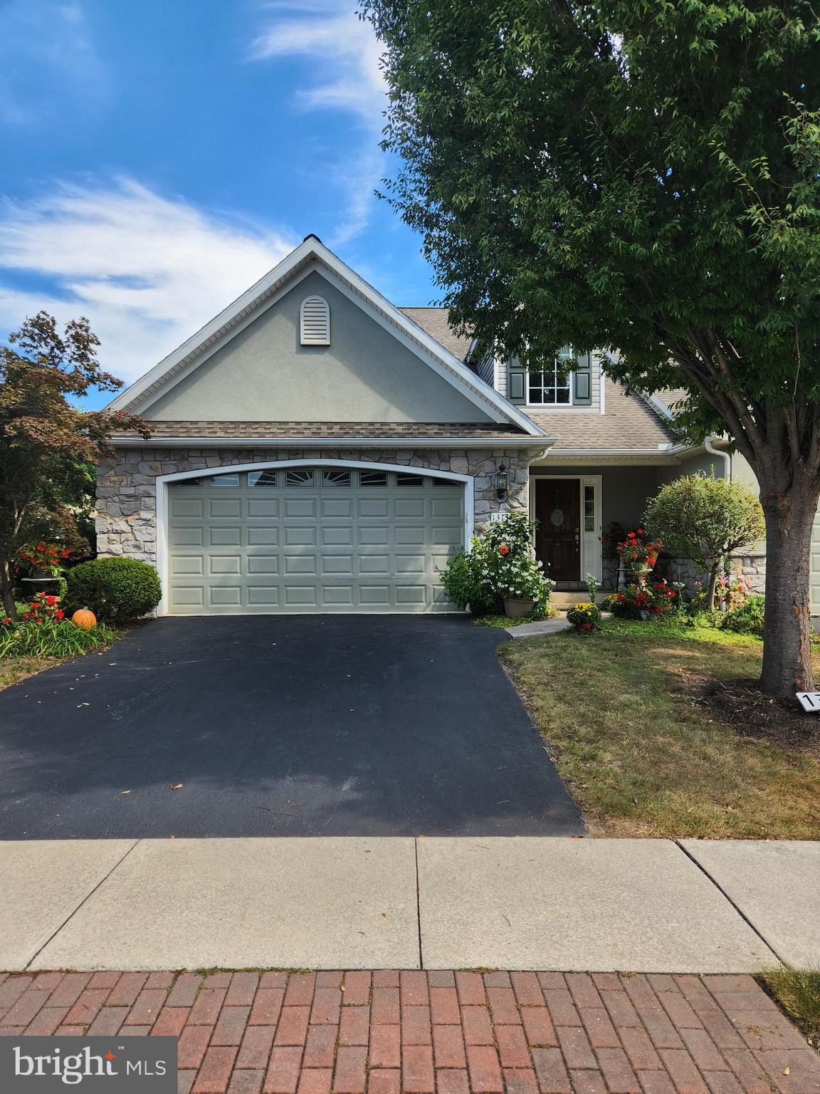 This property will be offered at Public Auction on Monday, October 20, 2025 @ 6pm. The listing price is the opening bid only and in no way reflects the final sale price. 10% down due at auction, 2% transfer tax to be paid by the purchaser, real estate taxes prorated. This exceptional property served as the
developer’s model home and includes many additional features and amenities. The welcoming formal entryway, complete with a storage closet and convenient powder room, opens into a stunning great room featuring a vaulted tray ceiling, marble fireplace, and oak hardwood floors. Beyond the great room lies a custom oak kitchen with granite countertops, stainless steel appliances, and an eat-in area, as well as a sunroom overlooking the landscaped backyard with access to the private patio. The first-floor master suite includes a spacious walk-in closet, laundry area, and a full bathroom with a large, tiled shower & glass doors. Up the open staircase, you’ll find a large loft with an expansive walk-in closet, two additional bedrooms, and a full bathroom. Additional amenities include an oversized, attached garage with air conditioning, a full unfinished basement with an egress window, and beautifully maintained landscaping surrounding the property.