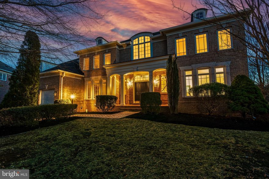This stunning 4 sided brick home is a true showpiece, offering nearly 7,000 sq. ft. of exquisite living space, sophisticated design, and carefully curated upgrades including a brand new roof!  Ideally situated at the end of a tranquil cul-de-sac, it provides exceptional privacy, backing to a serene expanse of mature woods. Freshly landscaped, the home boasts outstanding curb appeal, making a lasting first impression.

From the moment you enter the striking two-story foyer, you'll be drawn in by the elegant curved staircase and beautifully refinished hardwood floors. Freshly painted throughout, this home feels refreshed and inviting. The soaring two-story family room, flooded with natural light from a stunning wall of windows, offers a seamless connection to the outdoors. A thoughtfully modified floor plan enhances privacy while adding a touch of unexpected charm to the home's design.

Thoughtfully designed for both style and functionality, the chef’s dream kitchen boasts high-end appliances, sleek countertops, an oversized center island, and ample custom cabinetry, complemented by a spacious walk-in pantry. The adjacent butler’s pantry enhances convenience with additional storage and a built-in wine rack, making entertaining a breeze. Enjoy casual meals in the sunlit breakfast room while taking in serene wooded views. Tucked away behind the kitchen, the expansive laundry room offers a private retreat with direct access to the deck—perfect for savoring your morning coffee as you wait for the laundry to finish!

Upstairs, the landing welcomes you with beautifully refinished light-colored hardwood floors and overlooks the grand two-story foyer, framed by a stunning wall of windows. Beyond this elegant space, you'll find four generously sized bedrooms, all featuring brand-new carpeting. The luxurious primary suite, tucked behind elegant French doors, opens to a private sitting room and a spacious bedroom with a tray ceiling. It boasts two custom walk-in closets and a spa-inspired bathroom, complete with a corner soaking tub, dual vanities, and an expansive walk-in shower. Two of the secondary bedrooms share a spacious Jack and Jill bathroom, while the fourth bedroom enjoys the privacy of its own ensuite bath.

The fully finished walk-out basement is an entertainer’s dream, offering expansive living space and exceptional versatility. It features a private fifth bedroom, a full bathroom, and a den - offering endless possibilities for a home theater, game room, or fitness area, this lower level elevates both comfort and functionality.

Enjoy the convenience of being just minutes to schools, shopping, dining, and entertainment, including Harris Teeter, local cinemas, and more. Easy access to major commuter routes, the Ashburn Metro Silver Line, and INOVA Loudoun Hospital makes this home an unbeatable combination of luxury and location.
