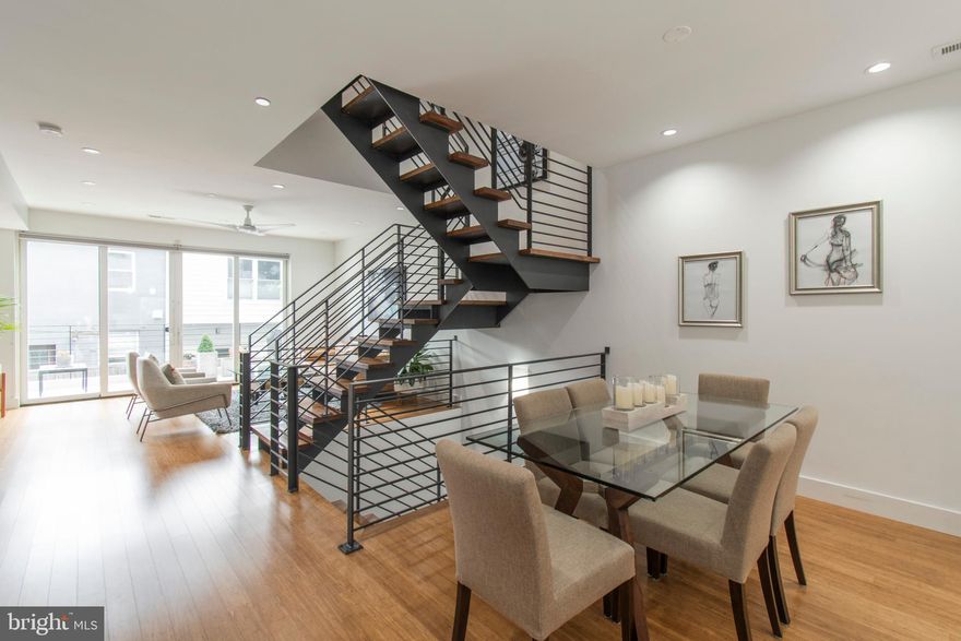 Spectacular, light-filled 19 ft. wide townhome with TWO CAR PARKING located in the Carpenter Square GATED community, with 5 YEARS LEFT ON THE TAX ABATEMENT. This contemporary and energy efficient townhome offers 4 Bedrooms, 3.5 Baths and 2,589 sq. ft. of luxurious living with two terraces, a green roof and beautiful designer finishes throughout. The main level features a spacious and open layout with a European Kitchen, Dining Room, Powder Room, Pantry closet, a vacuum/stroller closet and a gracious Living Room with expansive double glass sliders out to a large outdoor terrace. The Kitchen features VIKING Stainless Steel appliances, custom cabinetry, Quartz countertops, a zero radius stainless sink with tile backsplash. The open steel and wood staircase leads up to the second level which features two large Bedrooms that share a full Bathroom along with a full size Laundry room. The entire third floor is a stunning Master Suite which boasts a wet bar with wine fridge, a huge walk in closet, a second full closet, a Spa like Bath with double vanities, a glass enclosed shower, a private toilet room and an intimate terrace with a set of spiral stairs up to a green roof and a roof top patio. The finished lower level is ideal for an in-home office, fourth guest Bedroom with its own full Bath or in-home gym. This home was designed for entertaining in mind. Wood Floors throughout. Several green and energy efficient amenities are found in the home. 2-Zoned HVAC. Home has an abundance of closet space and storage. Across from Carpenter Green Park. Home is LEED Certified