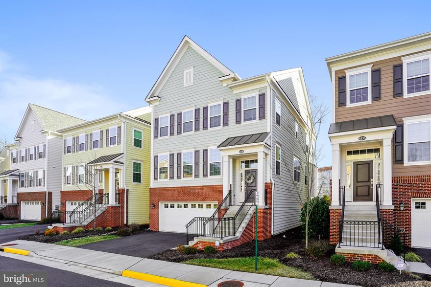 Nearly New Home Next to George Mason University and blocks to Historic Downtown Fairfax City.  Spacious and Airy modern living open floor plan is gorgeous and full of upgraded features with  5BR/3.5BA on 3 smart living levels.  Amazing open concept main level living features hardwood floors, custom plantation shutters, expansive wow kitchen, granite tops, high-end green stainless appliances, great cabinet space, and a huge island overlooking bright and spacious living - dining area with sleek fireplace that leads out through custom oversized sliding doors to a full sized deck featuring convenient awning.  The main level also has a cozy breakfast nook next to the kitchen, an office space/5th BR with french doors and powder room.  Downstairs is a huge rec room with lots of living options, sliding glass door to a fenced in yard, full bath, access to the 2-car garage and convenient storage closet/mud room area off the lower level foyer. The upper level features four bedrooms, with a pristine hall bath and convenient bedroom level laundry.   The master suite is spacious haven with windows on two sides, walk-in closet and upgraded en-suite featuring larger shower with seamless glass, dual vanities and private water closet.   Convenient attached 2-car garage and driveway parking space  HOA covers trash, some yard care and lovely common spaces. Home is situated on nice lot backing to trees on no thru-traffic street.  Prime location adjacent to GMU, blocks to Fairfax City, Parks, Shops, Restaurants, near Metro and more - Woodson Pyramid !